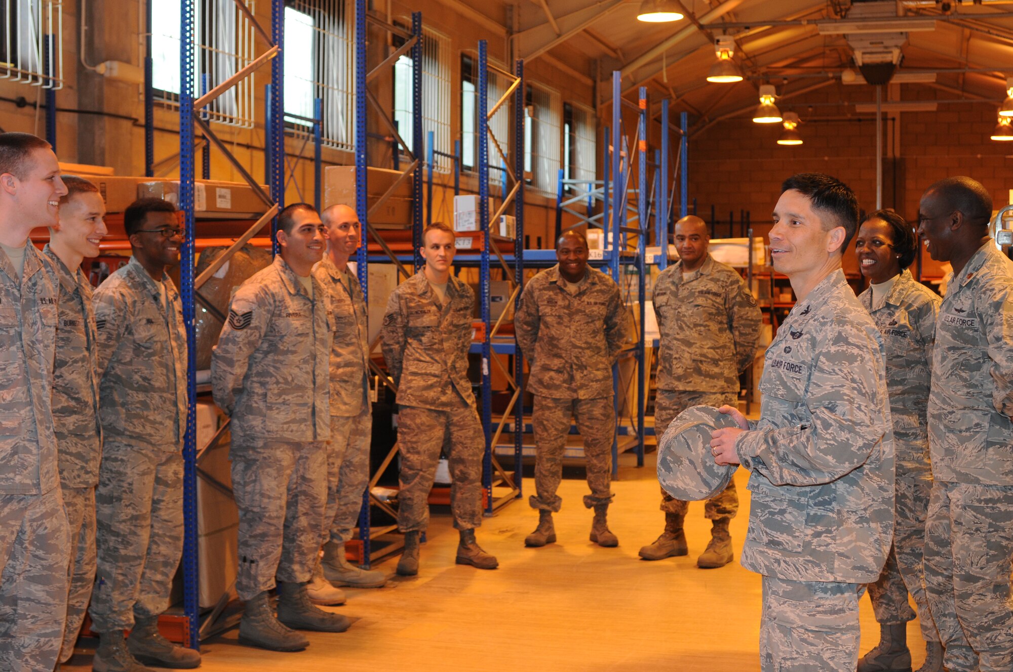 ROYAL AIR FORCE LAKENHEATH, England - Col. John Quintas, 48th Fighter Wing commander, congratulates Staff Sgt. Ross Koehler, 48th Communications Squadron military postal clerk, on his outstanding performance at RAF Lakenheath's Post Office, on April 28, 2011. Colonel Quintas recognized Sergeant Koehler and Tech Sgt. Mark Burleson, 48th CS military postal clerk as outstanding performers during the post office's recent Operation Readiness Inspection. (U.S. Air Force photo/Airman Cory Payne)