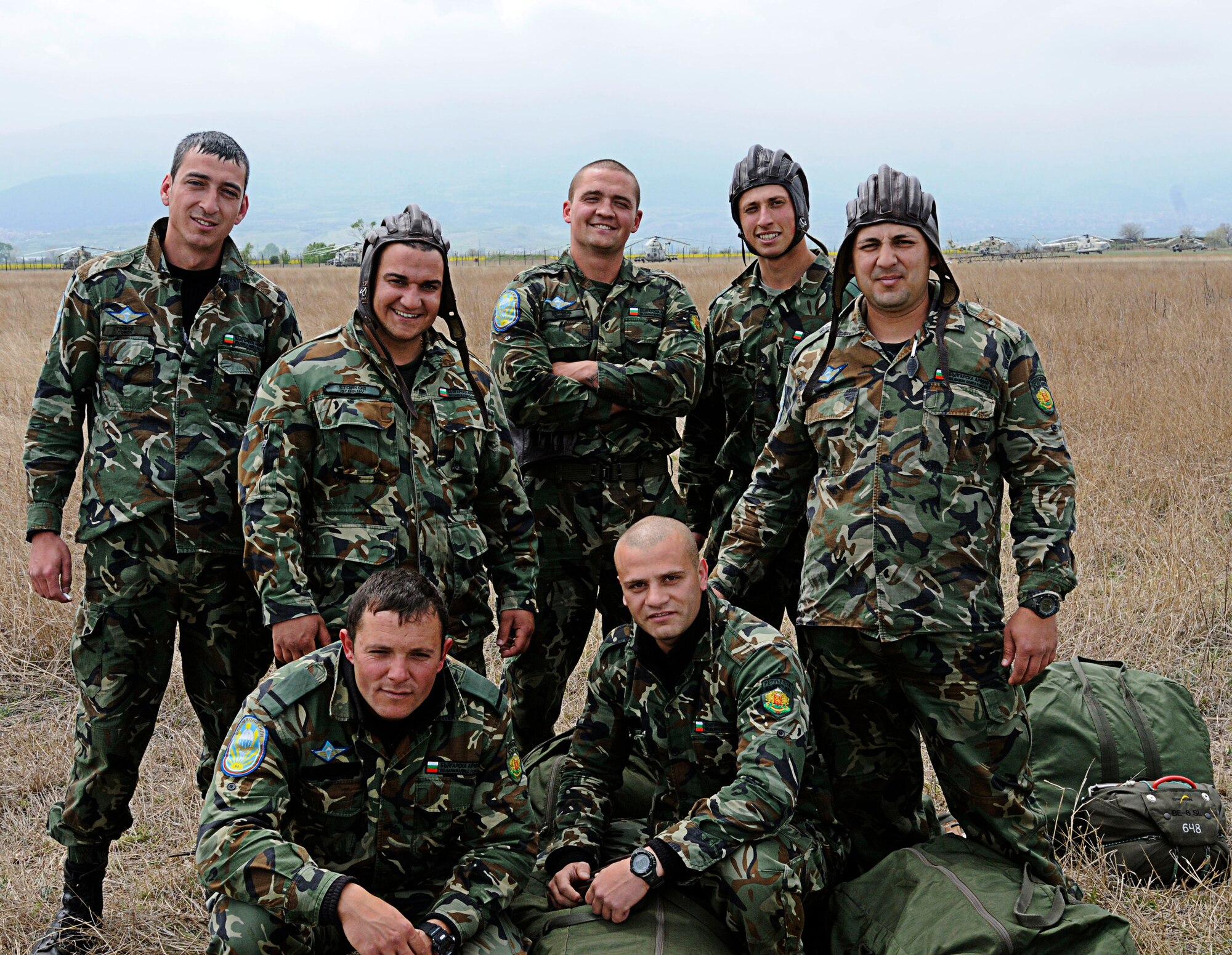 Bulgarian Air Force paratroopers pose for a photo at the drop zone near Plovdiv Airport, after a successful static line jump from a U.S. Air Force C-130J Super Hercules in support of Thracian Spring 2011, Plovdiv, Bulgaria, April 29, 2011. Thracian Spring 2011 is a two week on-site training designed to build partnerships between the U.S. and Bulgarian Air Force. (U.S. Air Force photo by Airman 1st Class Desiree W. Esposito)