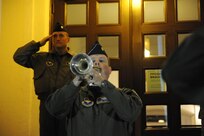 Maj. Bill Dorsey, from the 12th Flying Training Wing plays the bugle during a flag lowering ceremony at Randolph Air Force Base?s flagpole at the 12th Flying Training Wing Headquarters Building at 6 a.m. May 3.  The flag was lowered to half staff in remembrance of Maj. Jeff Ausborn who was killed in Kabul, Afghanistan, April 27.  Major Ausborn was a member of the 99th Flying Training Squadron from Randolph and members of his squadron and from throughout the 12 FTW held the ceremony in his honor.  A memorial service takes place May 3 at 10 a.m. at the base theater. At the time of his death, Major Ausborn, a 19-year Air Force veteran, was serving as a C-27 instructor pilot at the 438th Air Expeditionary Wing in Kabul, Afghanistan.(U.S. Air Force photo/Rich McFadden)