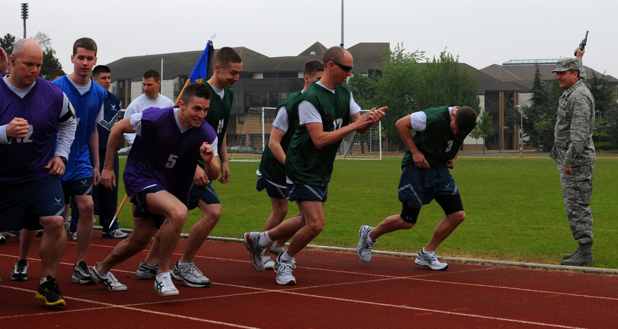 ROYAL AIR FORCE LAKENHEATH, England - Lt. Gen. Stephen Mueller, U.S. Air Forces in Europe vice commander, fires the starting pistol to kick off the 5K fun run at the beginning of the 48th Fighter Wing's Sports Day on April 29, 2011. Along with starting the race General Mueller took a tour of the 48th FW's Operation Group and the deployment processing line during his visit to RAF Lakenheath. (U.S. Air Force photo/Airman Cory Payne)