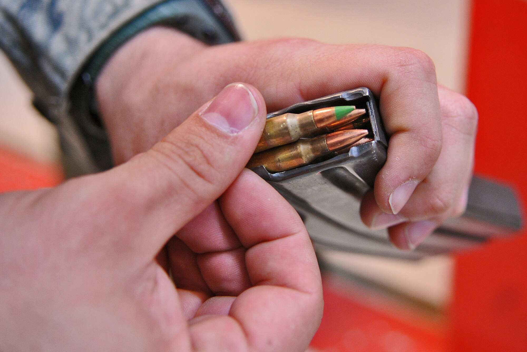 SPANGDAHLEM AIR BASE, Germany – Staff Sgt. Cesar Matos, 52nd Security Forces Squadron combat arms instructor, loads bullets into the magazine of an M-4 carbine assault rifle during weapons qualification training at the firing range April 28. Security forces Airmen are required to qualify on their weapons biannually. (U.S. Air Force photo/Senior Airman Nick Wilson)