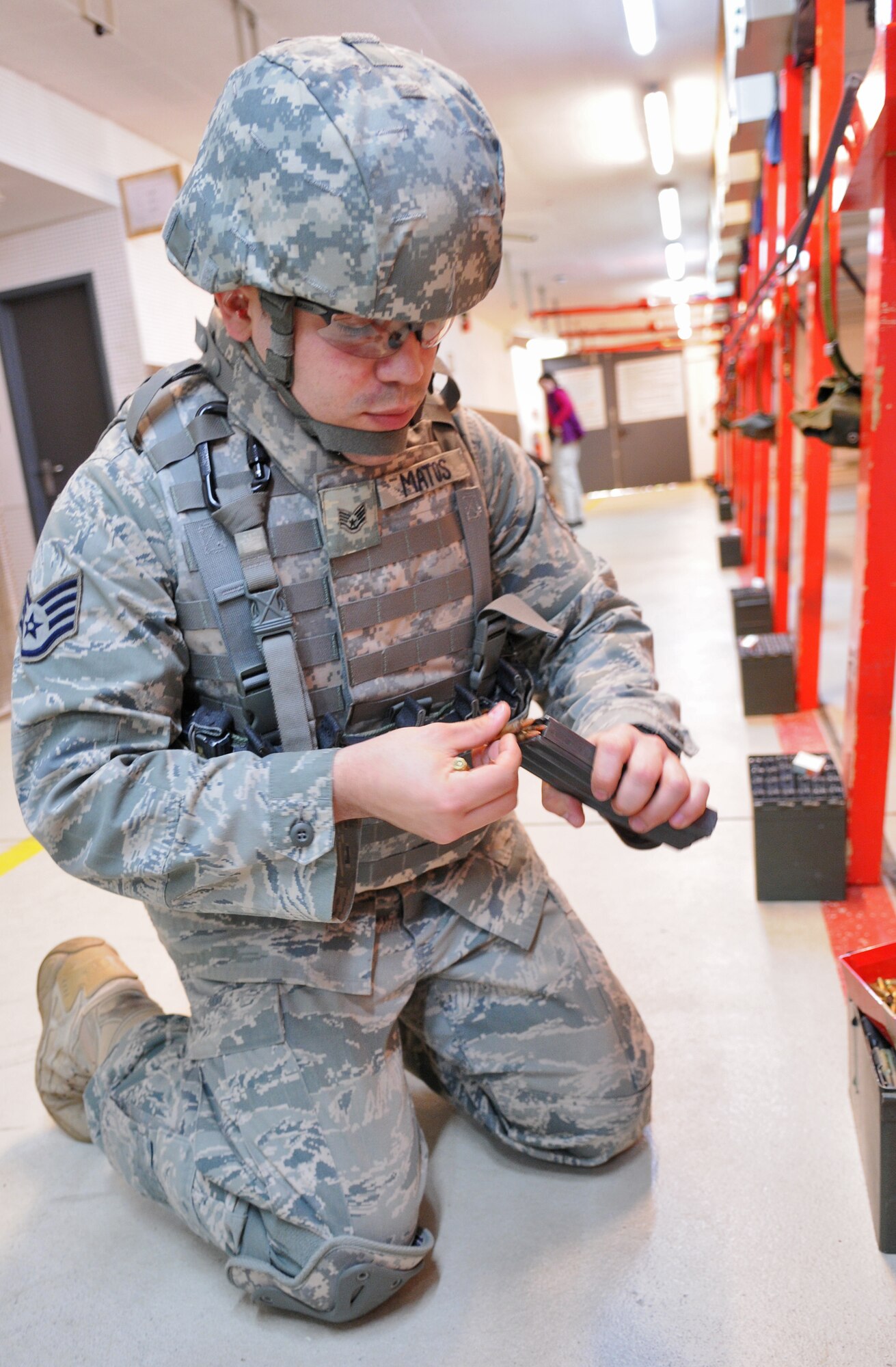 SPANGDAHLEM AIR BASE, Germany – Staff Sgt. Cesar Matos, 52nd Security Forces Squadron combat arms instructor, loads bullets into the magazine of an M-4 carbine assault rifle during weapons qualification training at the firing range April 28. Security forces Airmen are required to qualify on their weapons biannually. (U.S. Air Force photo/Senior Airman Nick Wilson)