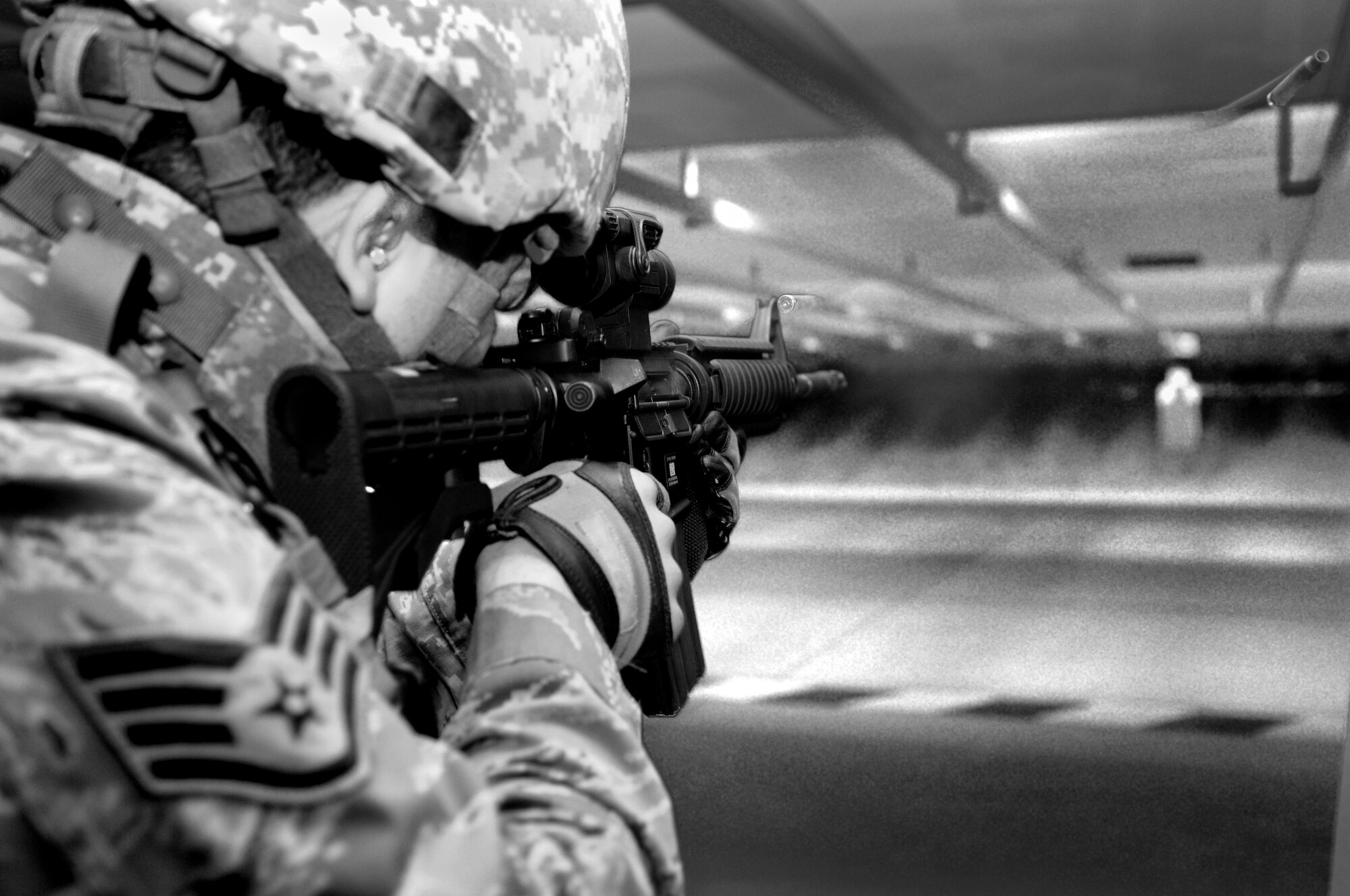 SPANGDAHLEM AIR BASE, Germany – Staff Sgt. Cesar Matos, 52nd Security Forces Squadron combat arms instructor, fires an M-4 carbine assault rifle during weapons qualification training at the firing range April 28. Security forces Airmen are required to qualify on their weapons biannually. (U.S. Air Force photo/Senior Airman Nick Wilson)