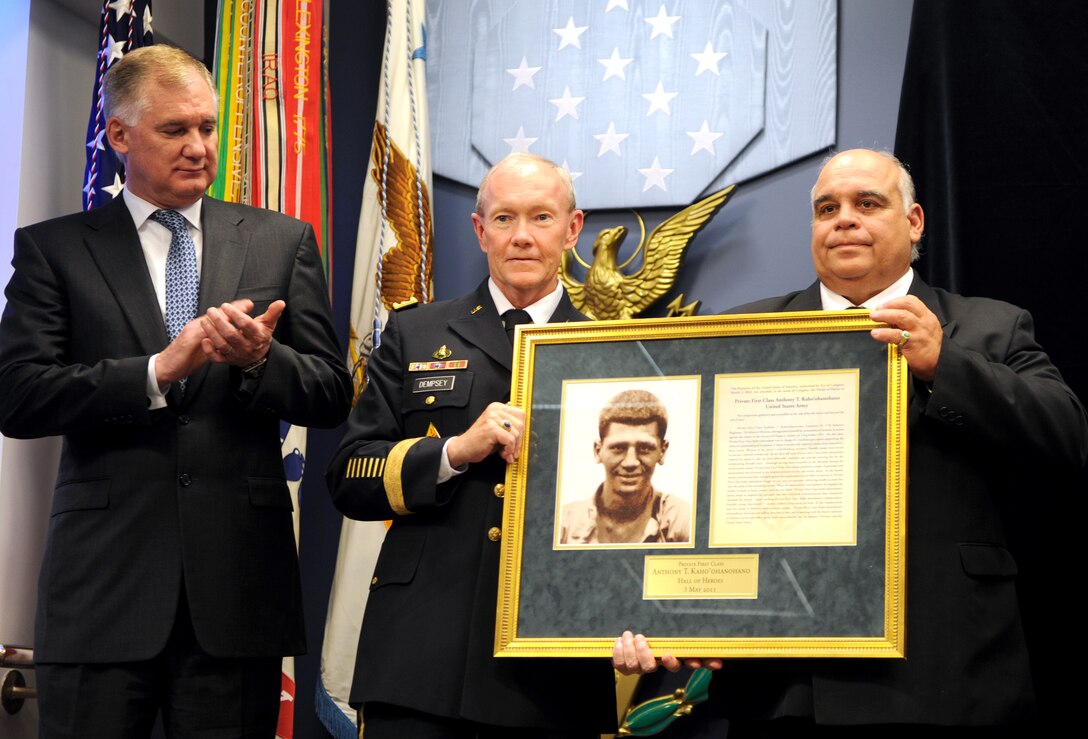 Deputy Defense Secretary William J. Lynn III, left, applauds as Army Chief of Staff Gen. Martin E. Dempsey, center, presents the Hall of Heroes induction plaque to George Kaho'ohanohano, right, nephew of Korean War Medal of Honor recipient Army Pfc. Anthony Kaho'ohanohano, during a ceremony at the Pentagon, May 3, 2011.  
