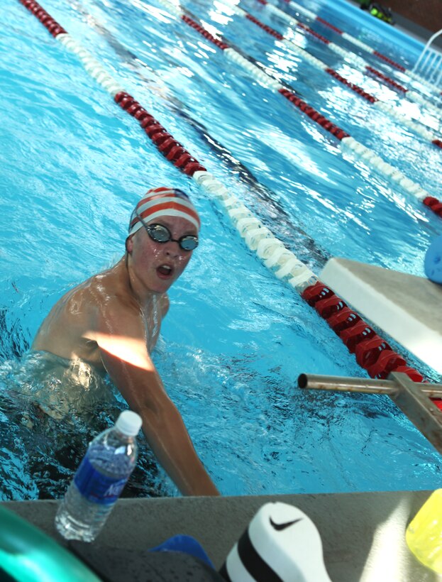 Tyler Ducar, a senior member of the Marine Corps Base Camp Lejeune Swim Team “Sharks”, and competitor in last year’s Junior Olympics as a long course swimmer, performs an open turn during practice at the Area 5 swimming pool aboard the base, May 4. Ducar said he enjoys swimming for the competition, to keep himself in shape and as another way to meet new people and make friends.