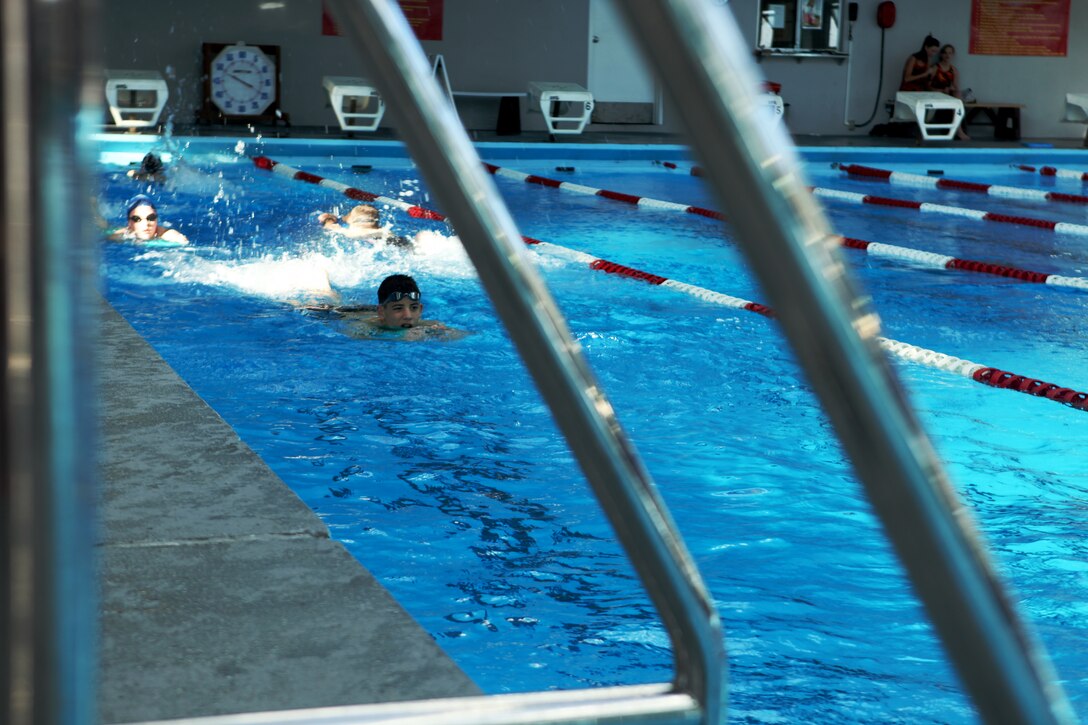 Members of the Marine Corps Base Camp Lejeune Swim Team “Sharks” make their way up and down a lane during practice at the Area 5 swimming pool aboard the base, May 4.