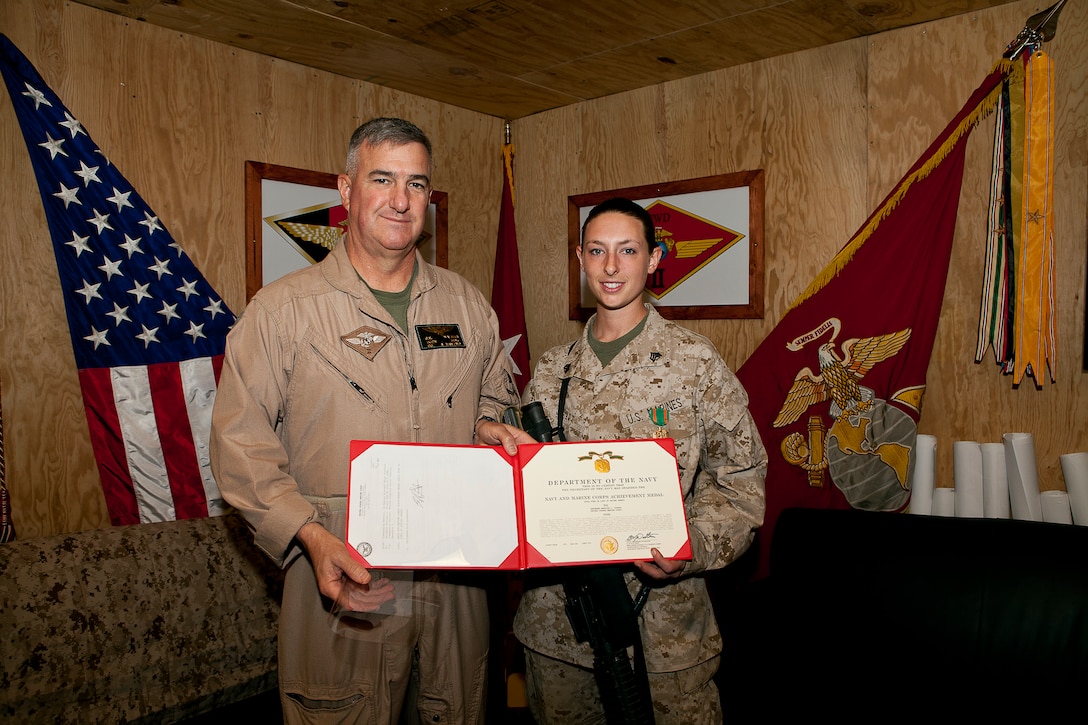 Sgt. Marissa L. Stuart, an intelligence analyst with Marine Unmanned Aerial Vehicle Squadron 2, was awarded the Navy and Marine Corps Achievement Medal by Brig. Gen. Glenn M. Walters at Camp Leatherneck, Afghanistan, May 4. Stuart, a native of Klamath Falls, Ore., supported coalition troops by gathering and disseminating information obtained by the ScanEagle UAV on more than 250 combat missions and was directly responsible for positively indentifying and providing the location of enemy forces on dozens of occasions, according to the citation of the award presented to her.