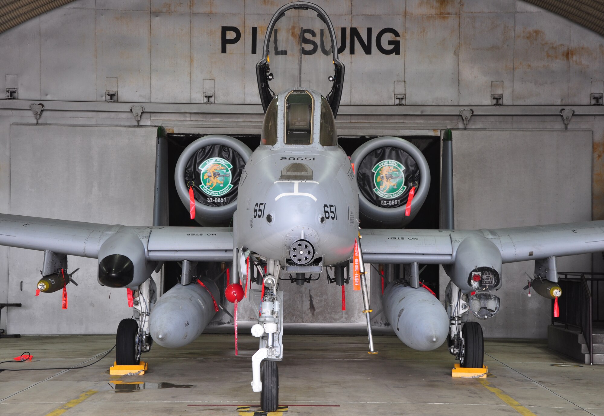 Airmen with the 51st Munitions Squadron and the 25th Aircraft Maintenance Unit recently worked together at building and loading some munitions onto an A-10 here. 51st MUNS built a dozen Mk-82 500-pound, free-fall, general-purpose bombs in order to hone and practice their skills. The Airmen then delivered the munitions to the Draggins Lair where the 25th AMU Airmen loaded an A-10. (U.S. Air Force photo/Staff Sgt. Chad Thompson)