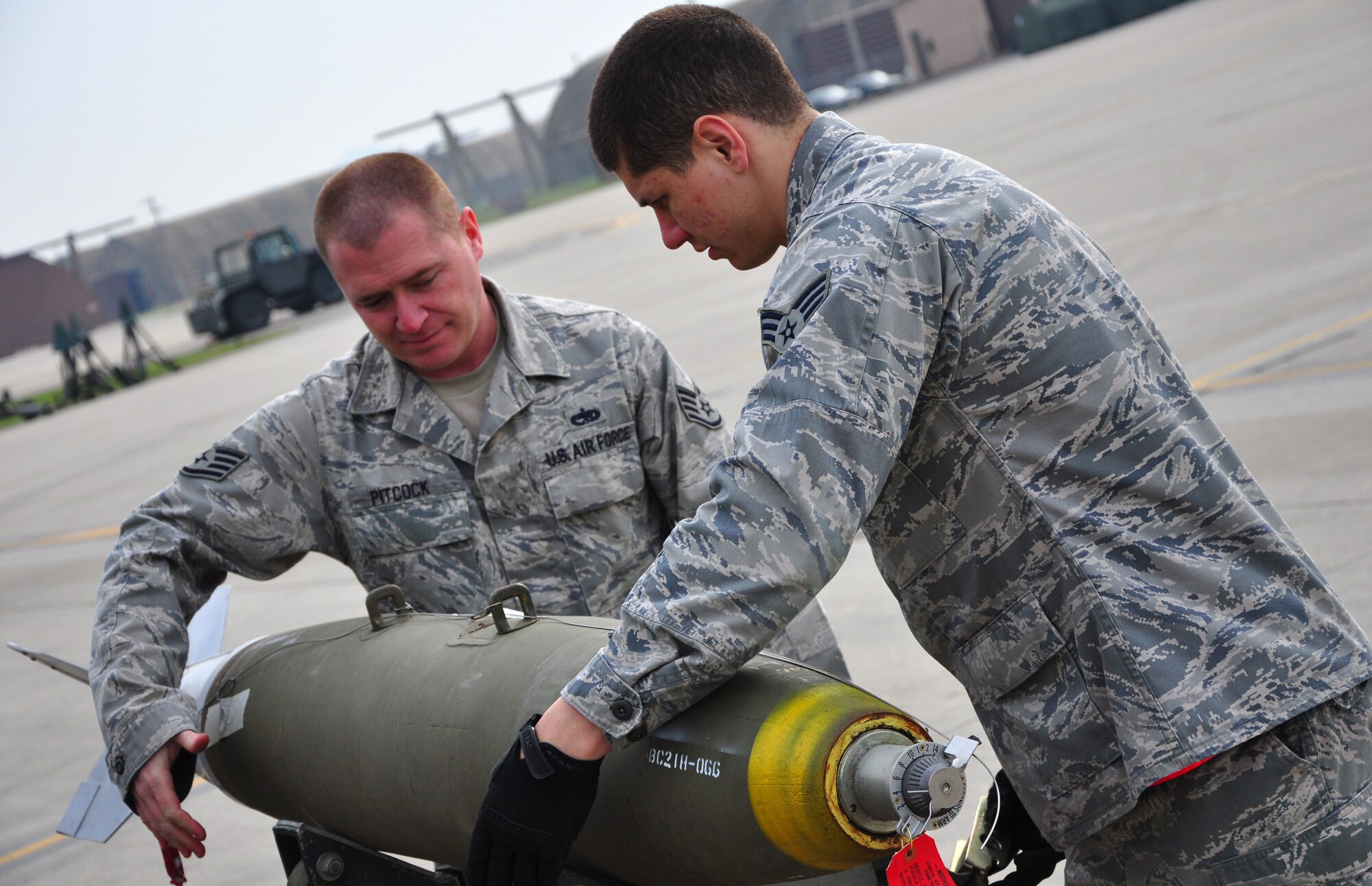 Airmen with the 51st Munitions Squadron and the 25th Aircraft Maintenance Unit recently worked together at building and loading some munitions onto an A-10 here. 51st MUNS built a dozen Mk-82 500-pound, free-fall, general-purpose bombs in order to hone and practice their skills. The Airmen then delivered the munitions to the Draggins Lair where the 25th AMU Airmen loaded an A-10. (U.S. Air Force photo/Staff Sgt. Chad Thompson)