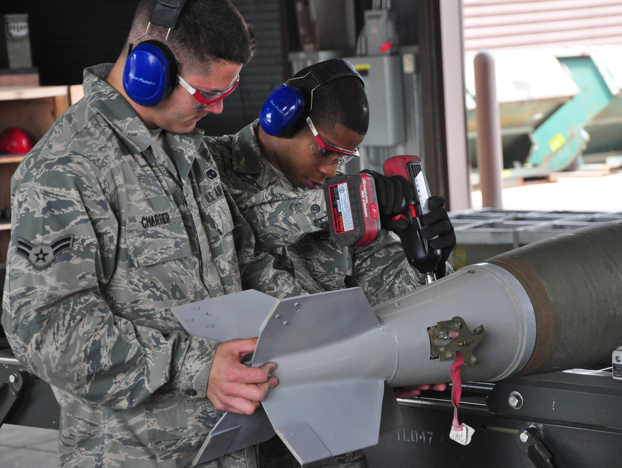 Airmen with the 51st Munitions Squadron and the 25th Aircraft Maintenance Unit recently worked together at building and loading some munitions onto an A-10 here. 51st MUNS built a dozen Mk-82 500-pound, free-fall, general-purpose bombs in order to hone and practice their skills. The Airmen then delivered the munitions to the Draggins Lair where the 25th AMU Airmen loaded an A-10. (U.S. Air Force photo/Staff Sgt. Chad Thompson)