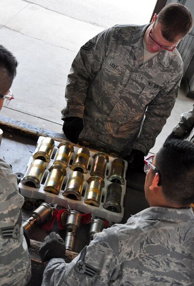 Airmen with the 51st Munitions Squadron and the 25th Aircraft Maintenance Unit recently worked together at building and loading some munitions onto an A-10 here. 51st MUNS built a dozen Mk-82 500-pound, free-fall, general-purpose bombs in order to hone and practice their skills. The Airmen then delivered the munitions to the Draggins Lair where the 25th AMU Airmen loaded an A-10. (U.S. Air Force photo/Staff Sgt. Chad Thompson)