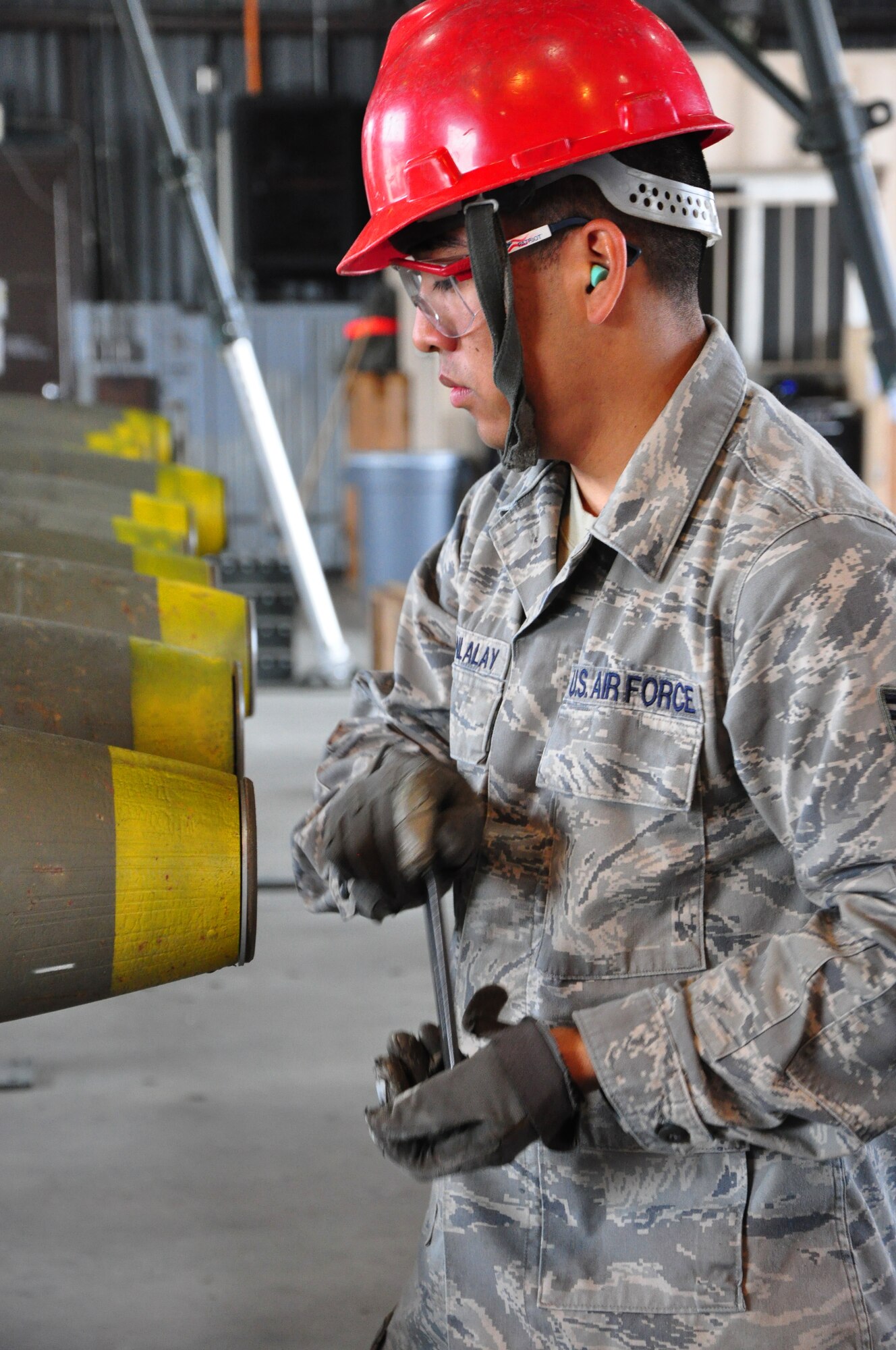 Airmen with the 51st Munitions Squadron and the 25th Aircraft Maintenance Unit recently worked together at building and loading some munitions onto an A-10 here. 51st MUNS built a dozen Mk-82 500-pound, free-fall, general-purpose bombs in order to hone and practice their skills. The Airmen then delivered the munitions to the Draggins Lair where the 25th AMU Airmen loaded an A-10. (U.S. Air Force photo/Staff Sgt. Chad Thompson)