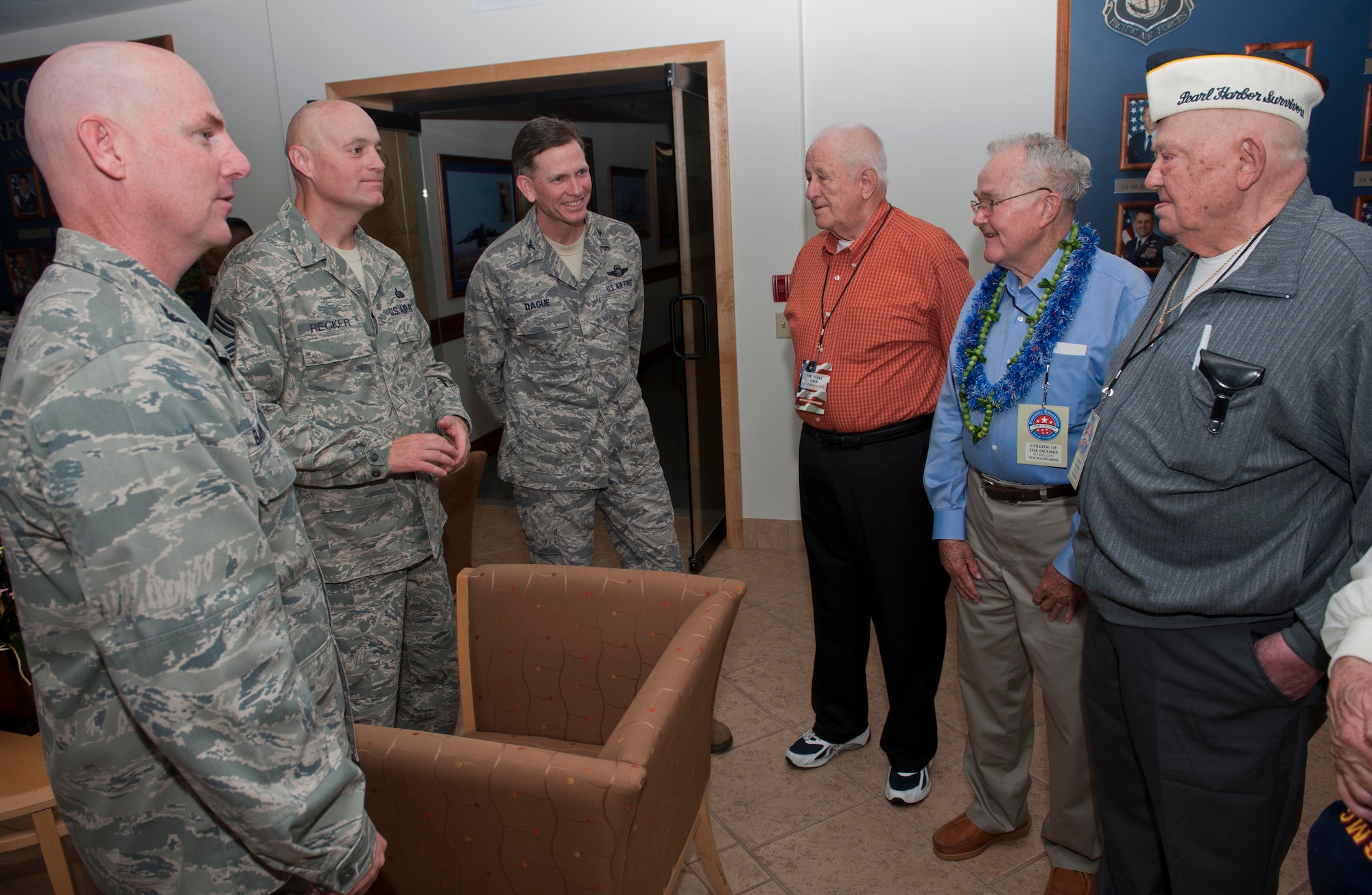 Col. Sam Barrett, 15th Wing commander, Chief Master Sgt. Craig Recker, 15th WG command chief, and Col. Joe Dague, 15th WG vice commander, speak to World War II veterans as well during the veterans' visit to the 15th WG headquarters building May 3 at Joint Base Pearl Harbor-Hickam, Hawaii. During their stay, the students and veterans also visited Atterbury Circle, the Pacific Air Forces headquarters building, and the missing man formation. (U.S. Air Force photo/Staff Sgt. Nathan Allen)