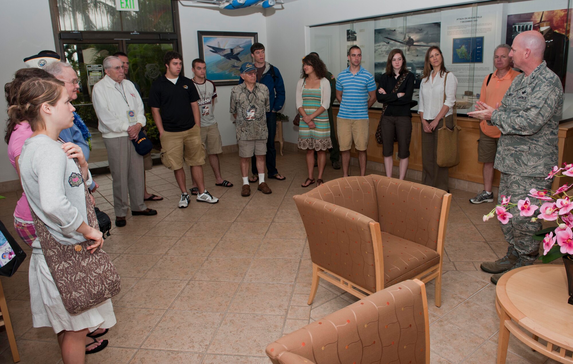 Col. Sam Barrett, 15th Wing commander, speaks to World War II veterans as well as students from the College of the Ozarks in Point Lookout, Mo. during a visit to the 15th WG headquarters building May 3 at Joint Base Pearl Harbor-Hickam, Hawaii. During their stay, the students and veterans also visited Atterbury Circle, the Pacific Air Forces headquarters building, and the missing man formation. (U.S. Air Force photo/Staff Sgt. Nathan Allen)