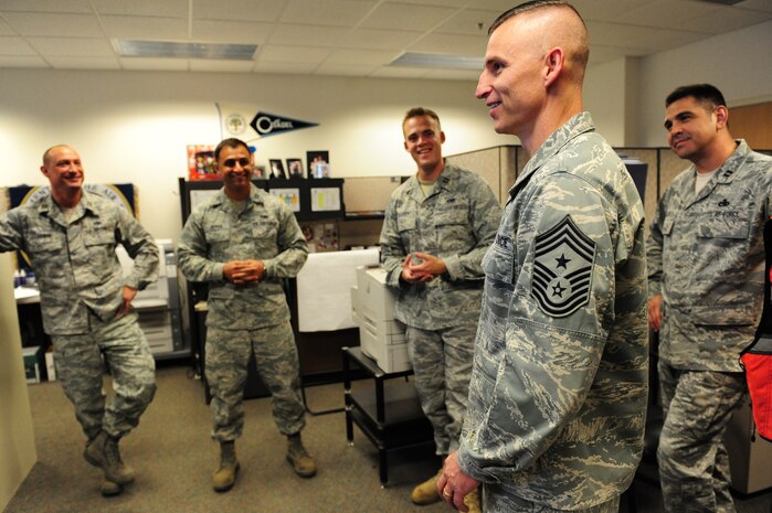 NELLIS AIR FORCE BASE, Nev., -- Capts.  Josh Ziemak, Josh Depaul, Jon Barry and Pete Leija, Advanced Maintenance and Munitions Officer School instructors, meet Chief Master Sgt. Michael Klintworth, 57th Wing command chief, at the AMMOS school house May 3.  AMMOS conducts the most advanced and comprehensive training of expeditionary combat support processes to develop highly skilled professionals capable of integrating all facets of Agile Combat Support anywhere in the world. (U.S. Air Force photo / Staff Sgt. William P.Coleman)