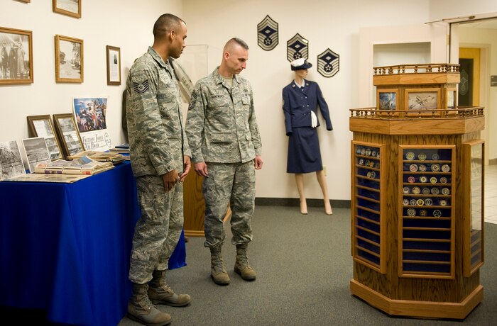 NELLIS AIR FORCE BASE, Nev.-- Tech. Sgt. Diogenes Cruz, Airman Leadership School senior instructor, leads Chief Master Sgt. Michael Klintworth, 57th Wing command chief, on a tour of the Airman Leadership School May 4. ALS prepares Airmen to become NCOs and effective supervisors. (U.S Air Force photo / Senior Airman Stephanie Rubi)