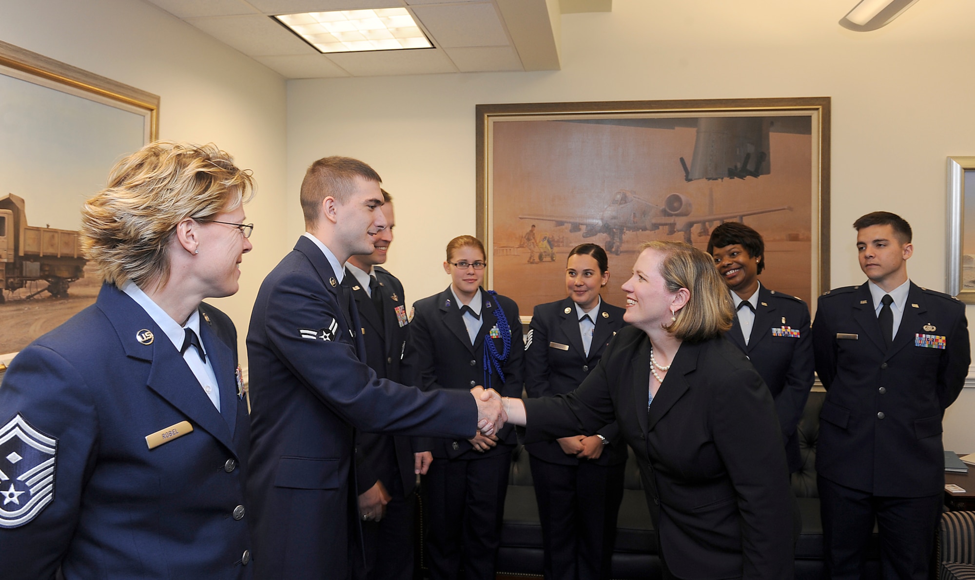 Undersecretary of the Air Force Erin Conaton congratulates members of the 52nd Fighter Wing from Spangdahlem Air Base, Germany, on receiving the 2011 Commander in Chief's Installation Excellence Award. The award, created in 1984, recognizes "the outstanding efforts of the people who operate and maintain Department of Defense installations, and effectively use their resources to support the mission," according to the Air Force secretary and chief of staff's announcement for the award. The award presentation took place May 3, 2011, during a ceremony in the Pentagon.  (U.S. Air Force photo/Scott Ash)