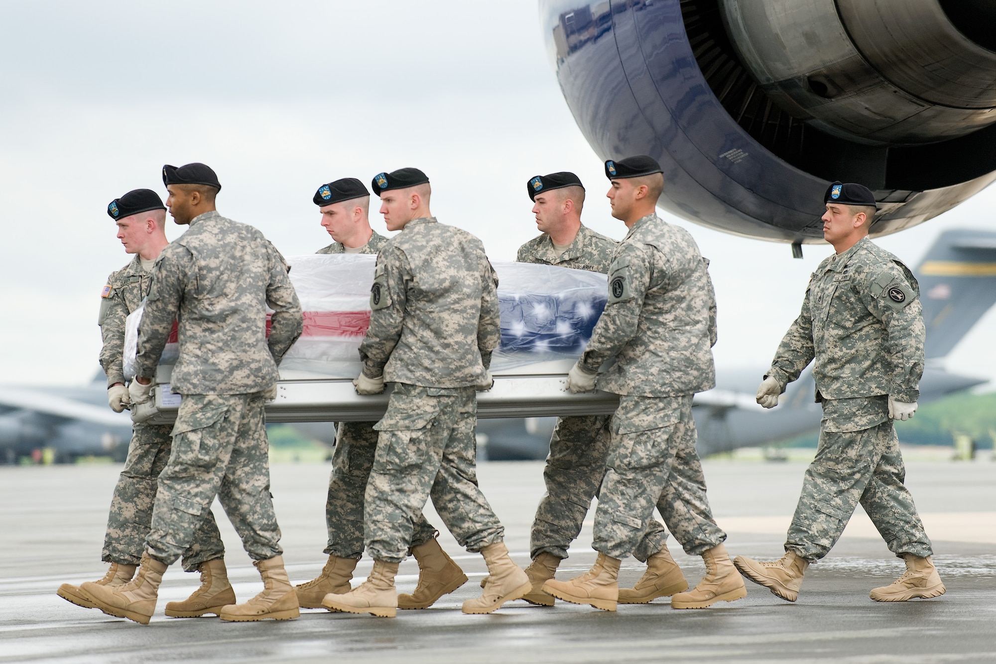 A U.S. Army carry team transfers the remains of Army Pfc. Robert M. Friese, of Chesterfield, Mich., at Dover Air Force Base, Del., May 4, 2011. Friese was assigned to the 1st Squadron, 3rd Armored Cavalry Regiment, Fort Hood, Texas. (U.S. Air Force photo/Roland Balik)