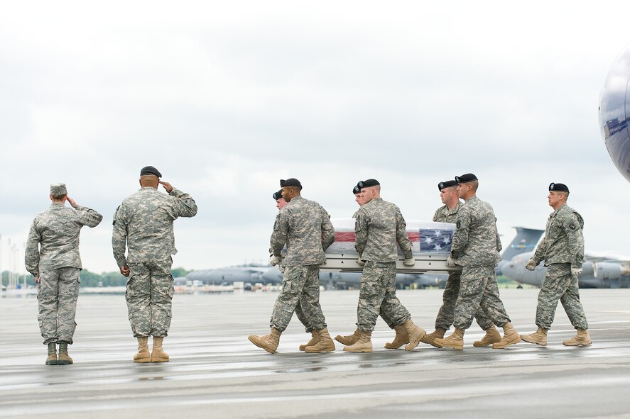 A U.S. Army carry team transfers the remains of Army Cpl. Kevin W. White, of Westfield, N.Y., at Dover Air Force Base, Del., May 4, 2011. White was assigned to the 2nd Battalion, 35th Infantry Regiment, 3rd Brigade Combat Team, 25th Infantry Division, Schofield Barracks, Hawaii. (U.S. Air Force photo/Roland Balik)