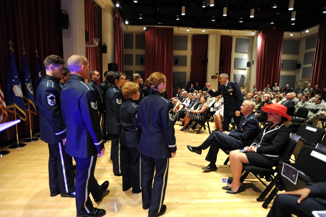 Colonel A. Phillip Waite leads the United States Air Force Singing Sergeants in a musical tribute during his promotion ceremony on April 29 at Historic Hanger 2, Joint Base Anacostia-Bolling, Washington, D.C.  Colonel Waite is the commander and conductor of The United States Air Force Band in Washington, D.C.  (U.S. Air Force photo by Senior Airman Christopher Ruano)