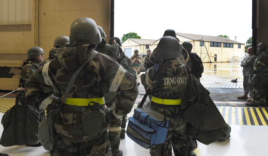 Airmen wait for cover during a phase two exercise May 3, 2011. The exercise gave Shaw Airmen the opportunity to train to respond to attacks in simulated wartime conditions.(U.S. Air Force photo/ Airman 1st Class Tabatha L. Duarte)