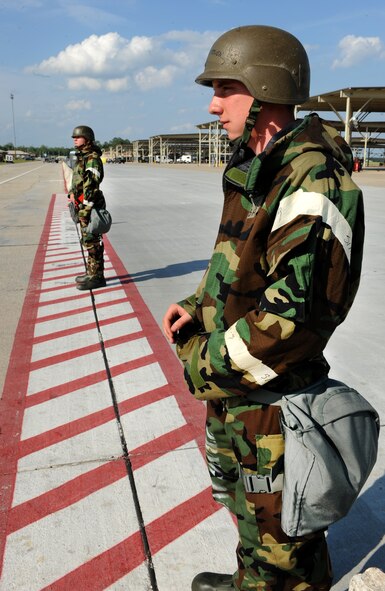 Airman 1st Class Steven Nugent, 55th Fighter Squadron "Shooters" crew chief and Airman 1st Class Matthew Carney, 55th Fighter Squadron crew chief, stand watch on Entry Control Point duty during a phase two exercise May 3, 2011. The exercise gave Shaw Airmen the opportunity to train to respond to attacks in simulated wartime conditions.(U.S. Air Force photo/ Airman 1st Class Tabatha L. Duarte)