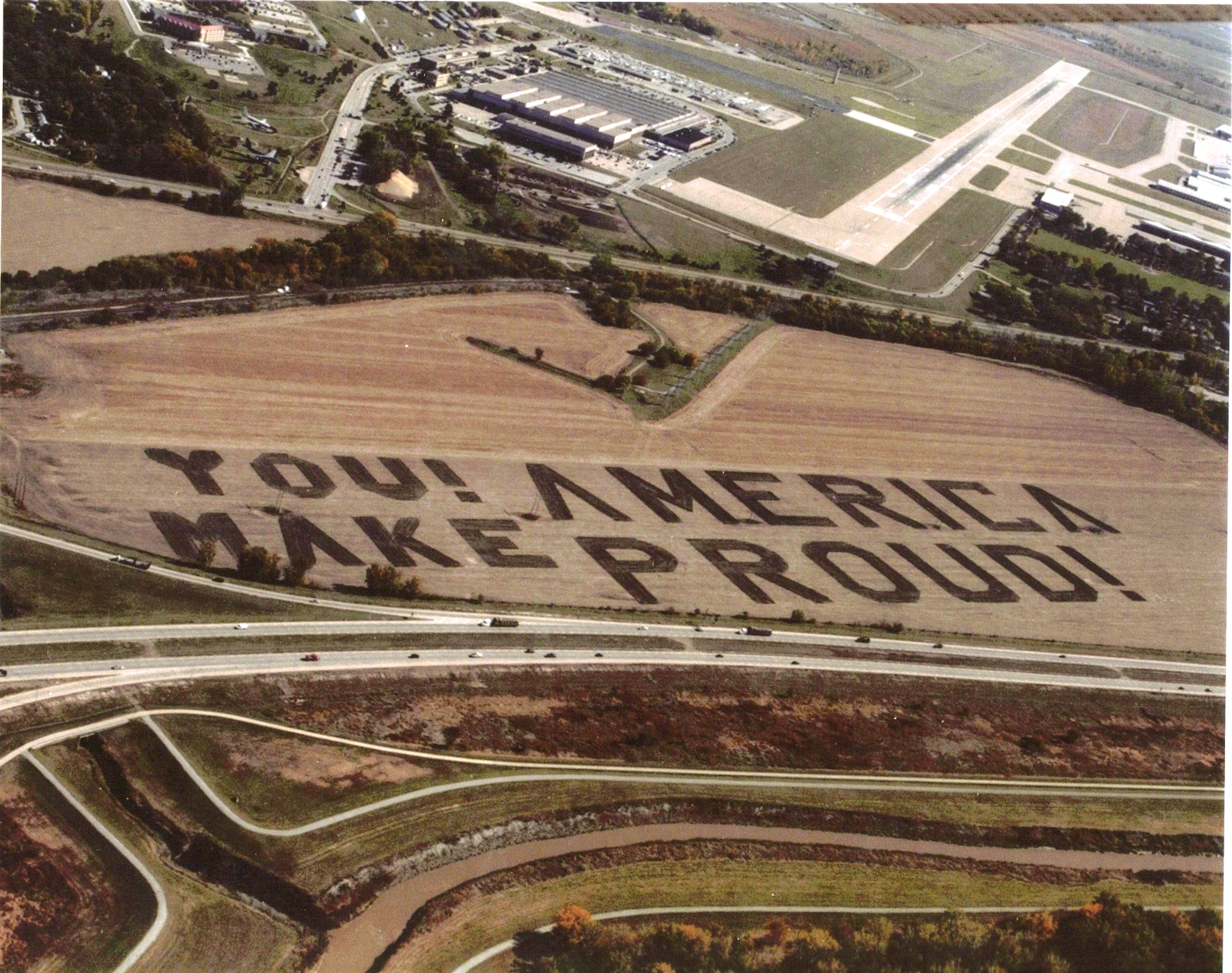 Every year, a message appears in local fields near Offutt Air Force Base, Neb., for Airmen to read as they fly overhead. Two fields are used to communicate these thank-you notes. This year, the message reads "You Make America Proud!" (Photo courtesy/Chris Shotten)