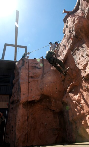 MOODY AIR FORCE BASE, Ga.-- U.S. Air Force Academy cadets scale a rock wall while being assisted by pararescuemen from the 38th Rescue Squadron during their base visit April 29.  A few cadets used the opportunity to make several trips down the wall. (U.S. Air Force photo/Airman 1st Class Benjamin Wiseman)(RELEASED)