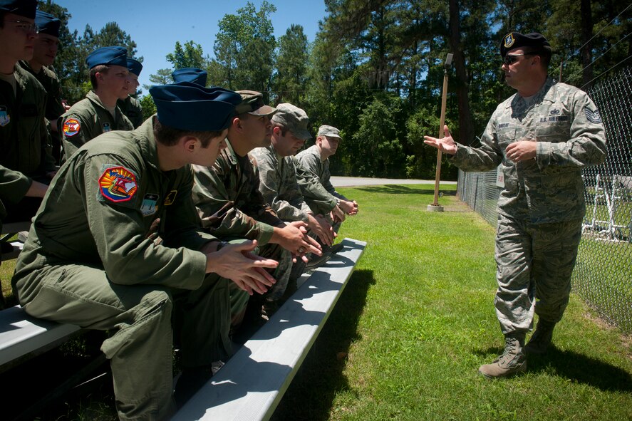 MOODY AIR FORCE BASE, Ga.-- Tech. Sgt. Randy Dauzat, 23rd Security Forces Squadron military working dog handler, speaks to U.S. Air Force Academy cadets during their base visit April 29. The 23rd SFS and 820 Base Defense Group also demonstrated the canine unit’s capabilities to the cadets during their visit to the kennels. (U.S. Air Force photo/Airman 1st Class Benjamin Wiseman)(RELEASED)