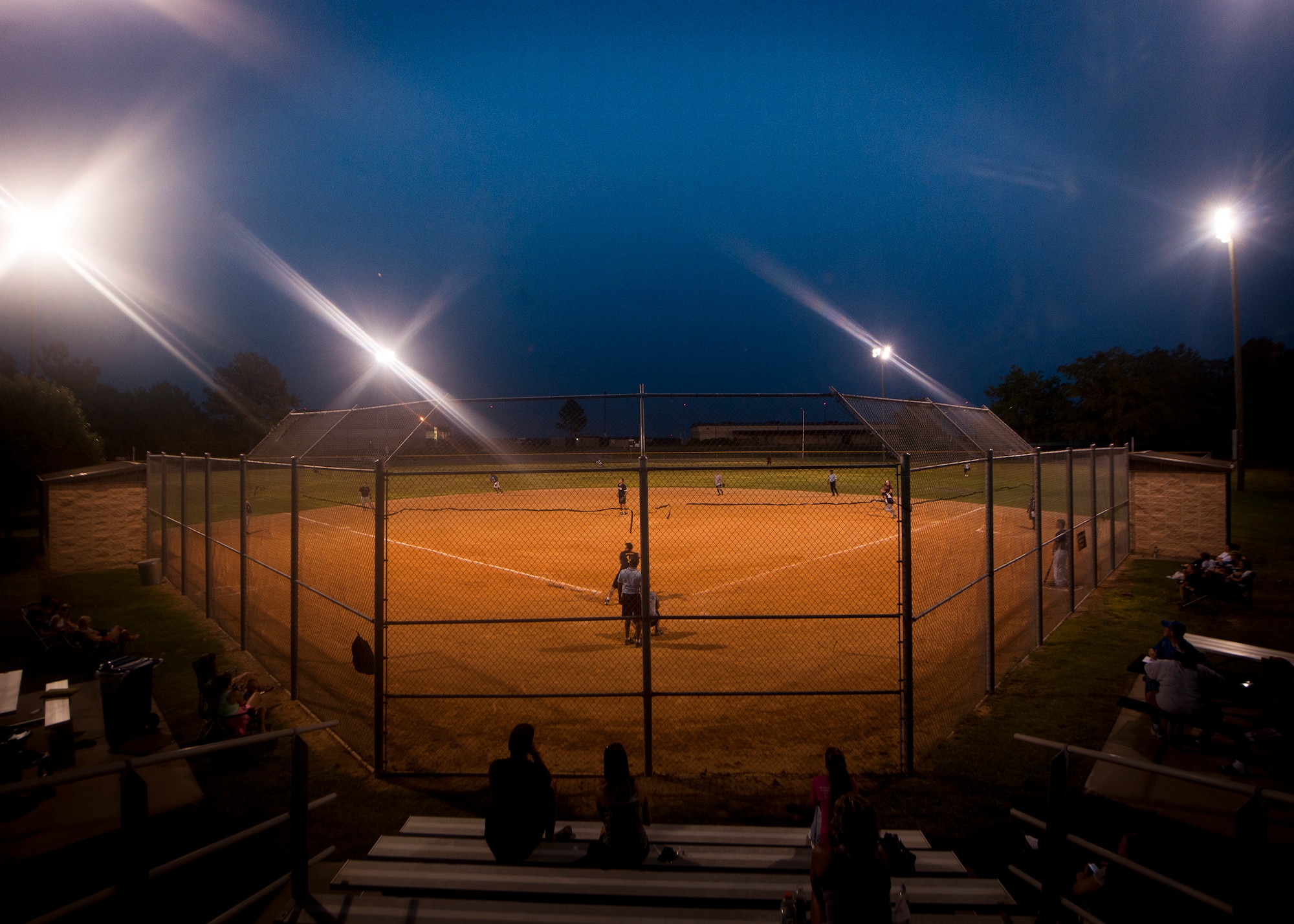 MOODY AIR FORCE BASE, Ga.-- Lights shine on the softball field on the opening day of the intramural softball season May 2. The 23rd Medical Group faced off against the 723rd Aircraft Maintenance Squadron with the 723rd AMXS gaining the lead in late innings and coming out on top. (U.S. Air Force photo/Airman 1st Class Joshua Green)(RELEASED)
