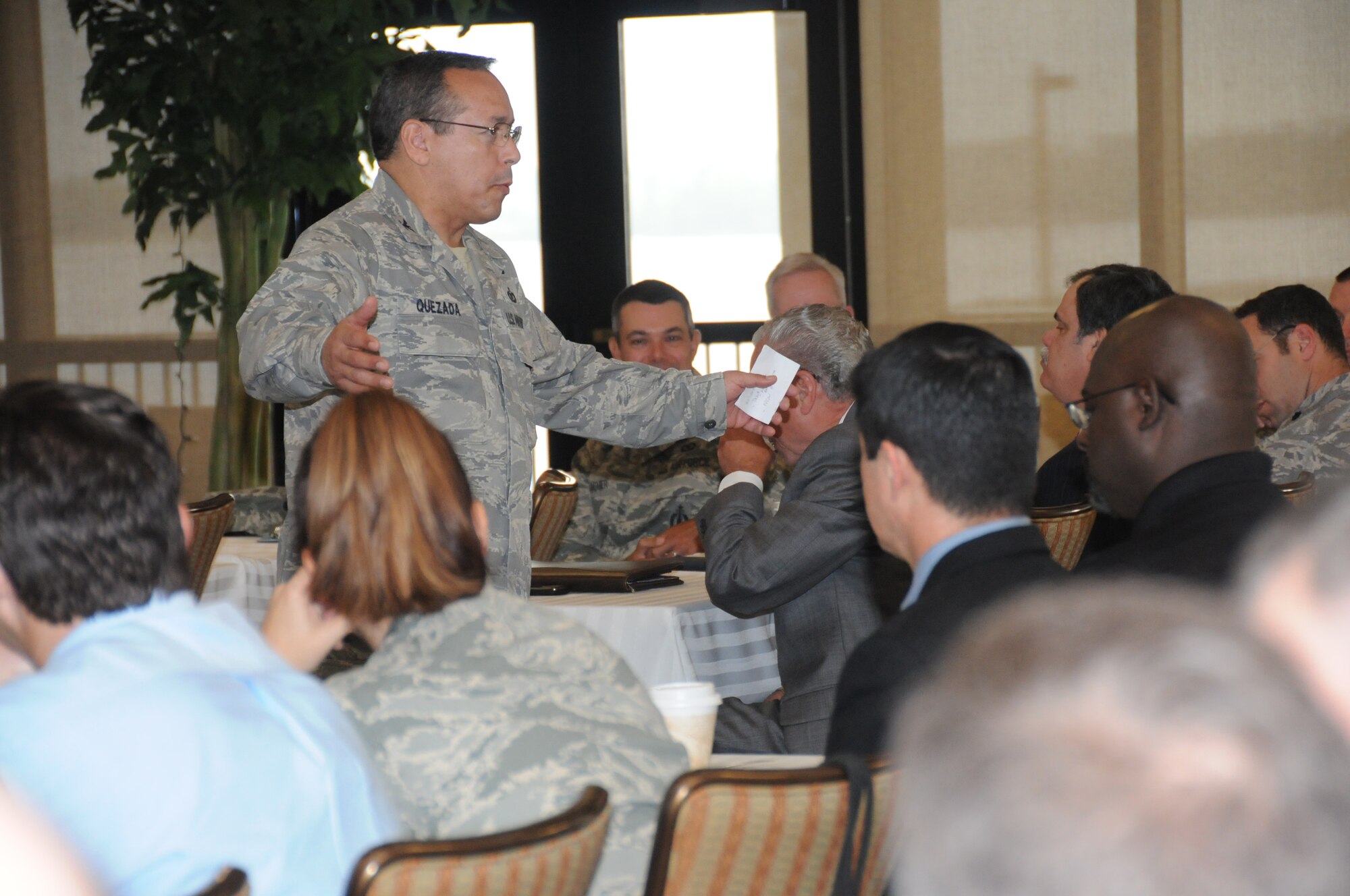 Col. Rafael Quezada gives opening remarks Tuesday at the Air Force's 2011 Airfield Operations Worldwide Conference at the Bay Breeze Event Center.  Colonel Quezada is the airfield operations officer career field manager at the Pentagon.  The conference, which ends Friday, brings together about 500 air traffic control and airfield management leaders from Air Force bases around the globe.  Brig. Gen. Andrew Mueller, 81st Training Wing commander, also spoke to the attendees.  The 334th Training Squadron is hosting the conference.  (U.S. Air Force photo by Kemberly Groue)
