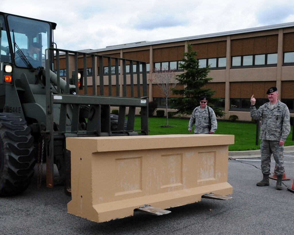 NIAGARA FALLS AIR RESERVE STATION, N.Y- Increased protective measures are being implemented at Niagara Falls ARS as well as other military installations around the world.  Members of the 914th security forces squadron place concrete barriers near various buildings on base.  (U.S. Air Force Reserve photo by Peter Borys)