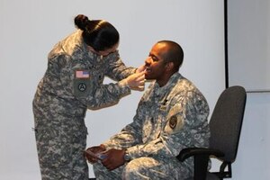 Sgt. 1st Class Jennifer Williams, Army Training Support Center instructor, gathers cheek swab samples from Sgt. 1st Class Torres Bultron, Army Aviation Logistics School instructor, during a bone marrow donation presentation at Hunter Hall at Fort Eustis, Va., April 20. The registration drives, scheduled for May 12 at Fort Eustis and Langley Air Force Base, will enroll eligible donors into the C.W. Bill Young Department of Defense Marrow Donor Program, established to recruit volunteer marrow donors from active-duty military, immediate family members, civil service employees, Coast Guardsmen, National Guardsmen, Reservists and retirees. (Courtesy photo/Sgt. 1st Class Jennifer Williams)