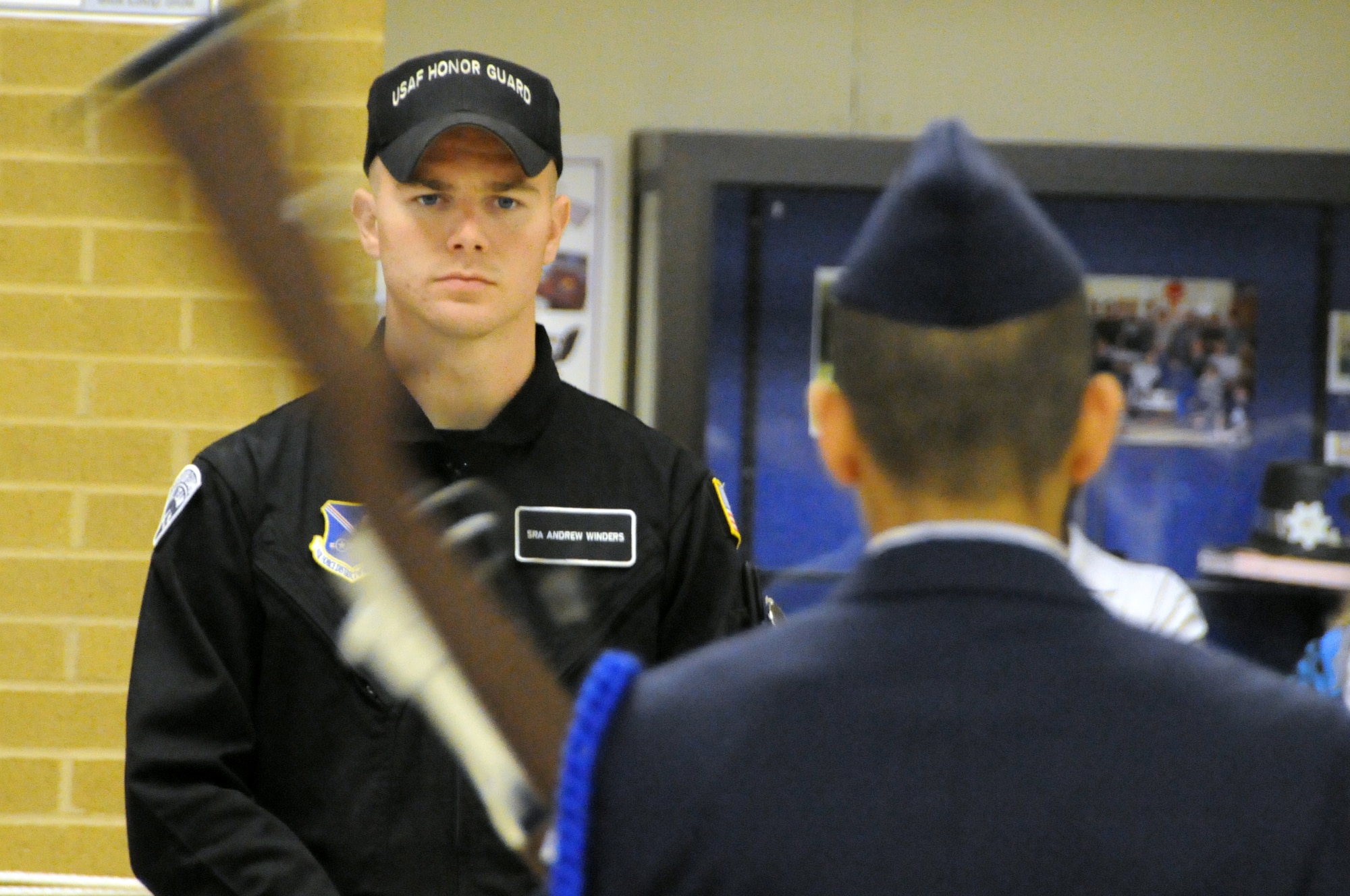Airman 1st Class Andrew Winders, member of the U.S. Air Force Honor Guard Drill Team, observes the JROTC cadet’s armed drill portion of the Virginia Air Force Association's JROTC drill competition April 30, 2011 at Atlee High School, Mechanicsville, Va. (U.S. Air Force photo by Airman 1st Class Tabitha N. Haynes)