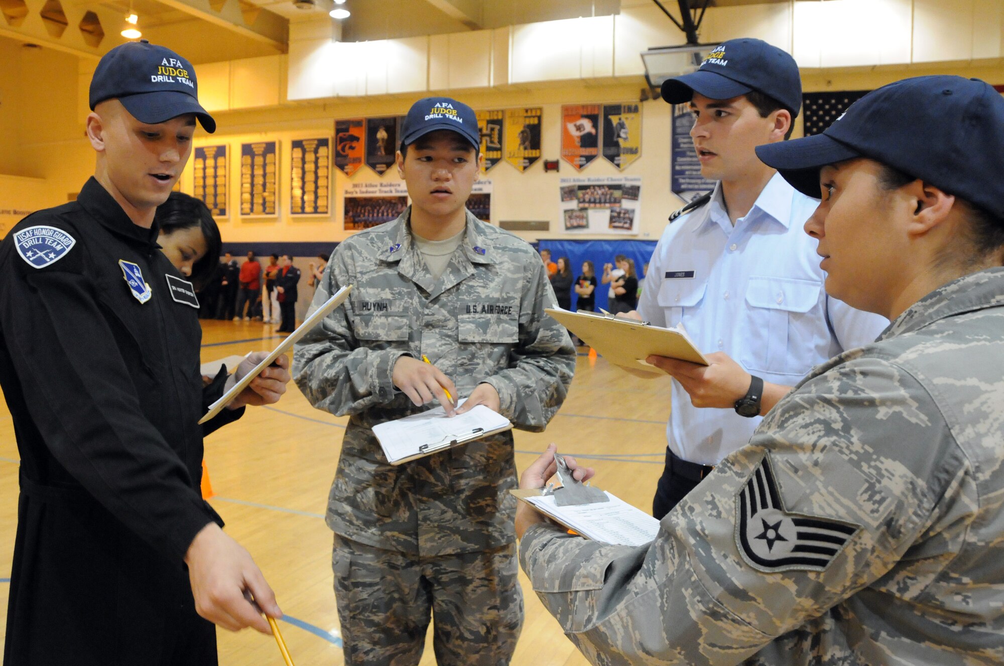 Judges at the Virginia Air Force Association’s JROTC drill competition review their remarks about the competing cadet unit April 30, 2011 at Atlee High School, Mechanicsville, Va. (U.S. Air Force photo by Airman 1st Class Tabitha N. Haynes)