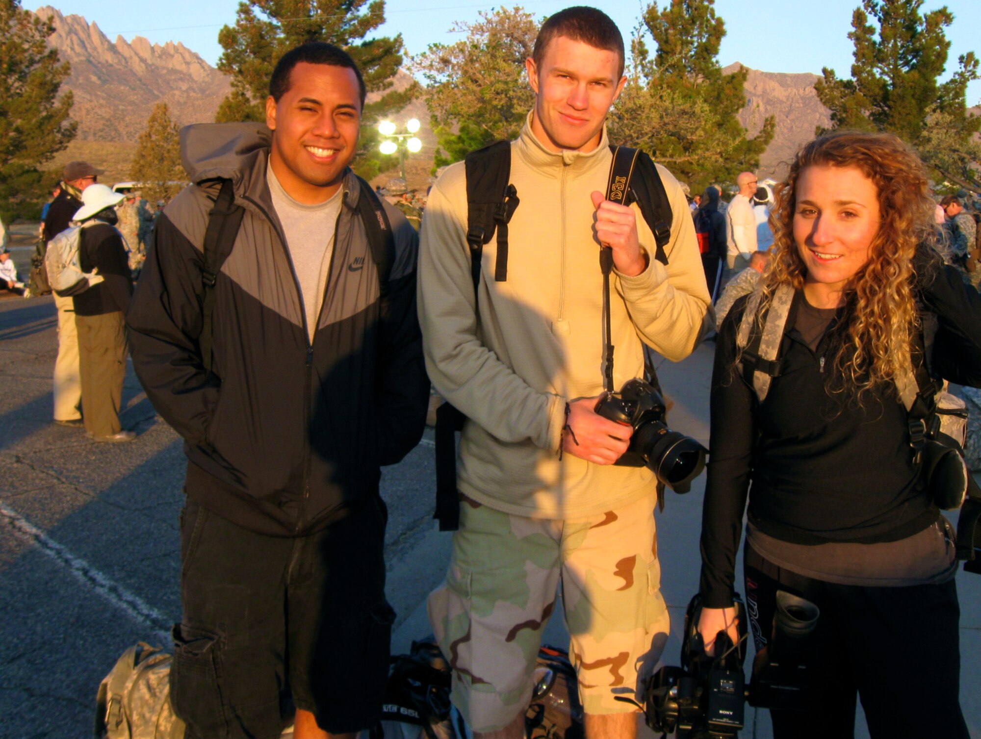 WHITE SANDS MISSLE RANGE, N.M. -- Airmen 1st Class Siuta Ika, Joshua Turner and Mari Mosteller, all from the 49th Wing Public Affairs Office, on March 27, 2011, covered the Bataan Memorial Death March for print, photo and broadcast stories. Airman Mosteller trained with the Senior NCO team to prepare for covering the march. Documenting the event solidified to her what a privilege it is to be an Air Force broadcaster and an American Airman. (Courtesy photo / Released)