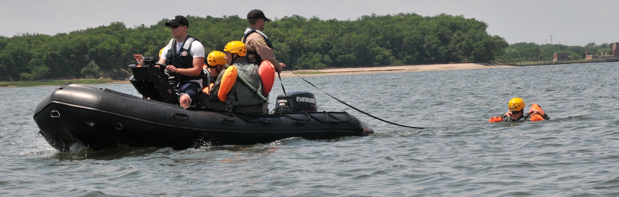 Ten Airmen from Joint Base Charleston participate in a seven-hour long Water Survival Training Course May 2, at the Charleston Harbor. The course must be taken every three years by every pilot and crew member in order to stay qualified to fly. The course is held during the spring and summer months and tests the student?s ability to release a parachute in the water, board a life raft and come out from under a parachute.  (U.S. Air Force photo /Airman 1st Class Jared Trimarchi)

