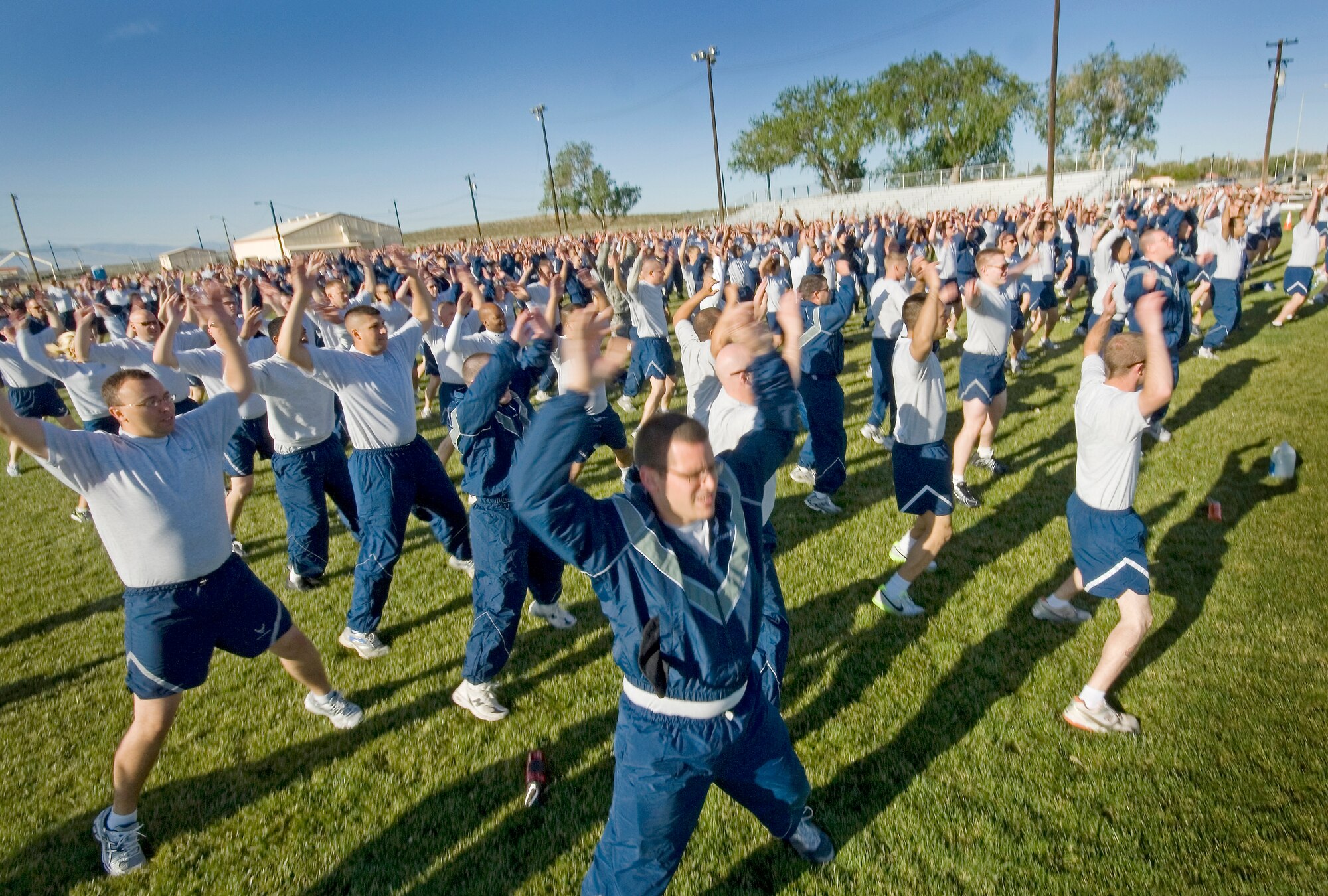 Airmen from the 412th Test Wing loosen up before taking on the first ever 412th TW Sports Day May 2. Most of the wing spent the morning competing in sporting events and intermingling with their fellow Airmen. “Each unit does an amazing job, but the success of the Test Wing depends on units and people interfacing with each other,” said Col. Dawn Dunlop, 412th TW commander. “We need to look for opportunities for our Airmen to get out there and work with each other and understand the components that each unit brings to the Test Wing mission.” (Air Force photo by Rob Densmore)