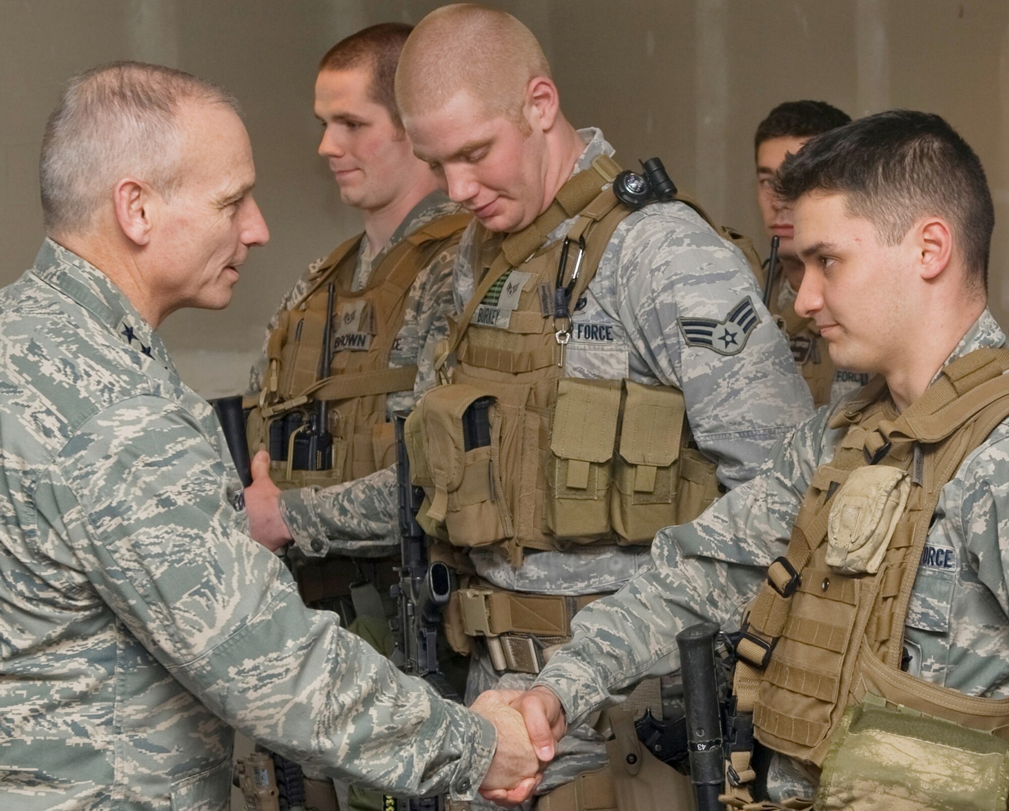One of the highlights of Lt. Gen. Kowalski's visit to Malmstrom included witnessing the Tactical Response Force on a real-world mission April 26. Here, the commander meets some of those team members, (left to right) Staff Sgt. Frederick Brown; Senior Airman Nicholas Burkey and Airman 1st Class Thomas Diblasio. In the rear is Senior Airman Justin Cora. (U.S. Air Force photo/Beau Wade)