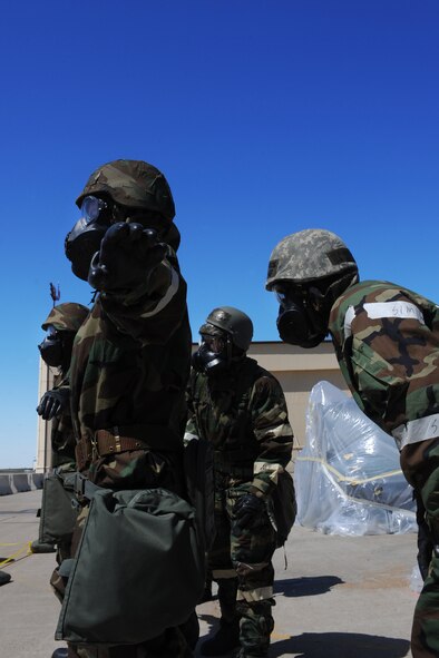 MINOT AIR FORCE BASE, N.D.-- Airmen check each other for contamination during an Ability to Survive and Operate exercise here May 2. The ATSO preparation exercise ensures that the Airman of Minot ready themselves for upcoming base wide inspections. (U.S. Air Force photo/ Airman 1st Class Aaron-Forrest Wainwright)