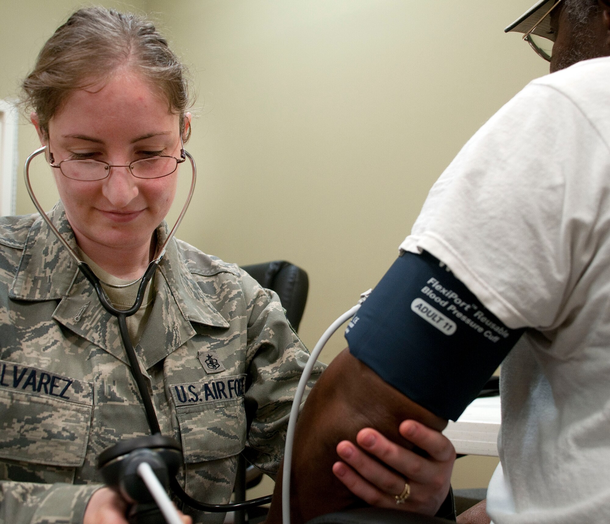 HAYNEVILLE, Ala. -- Master Sgt. Jessica Alvarez, a medical technician with the Alaska Air National Guard's 176th Medical Group, measures the blood pressure of an area resident at a free medical clinic here May 3, 2011. Twenty-five members of the medical group (together with 10 support personnel from other Alaska Air Guard units) arrived here May 1 for 12 days of training through the Innovative Readiness Program. This program allows Guard and Reserve members to get the training they need while at the same time delivering real-world results -- in this case, providing an array of health-care services to a historically underserved area. Alaska Air National Guard photo by Capt. John Callahan.