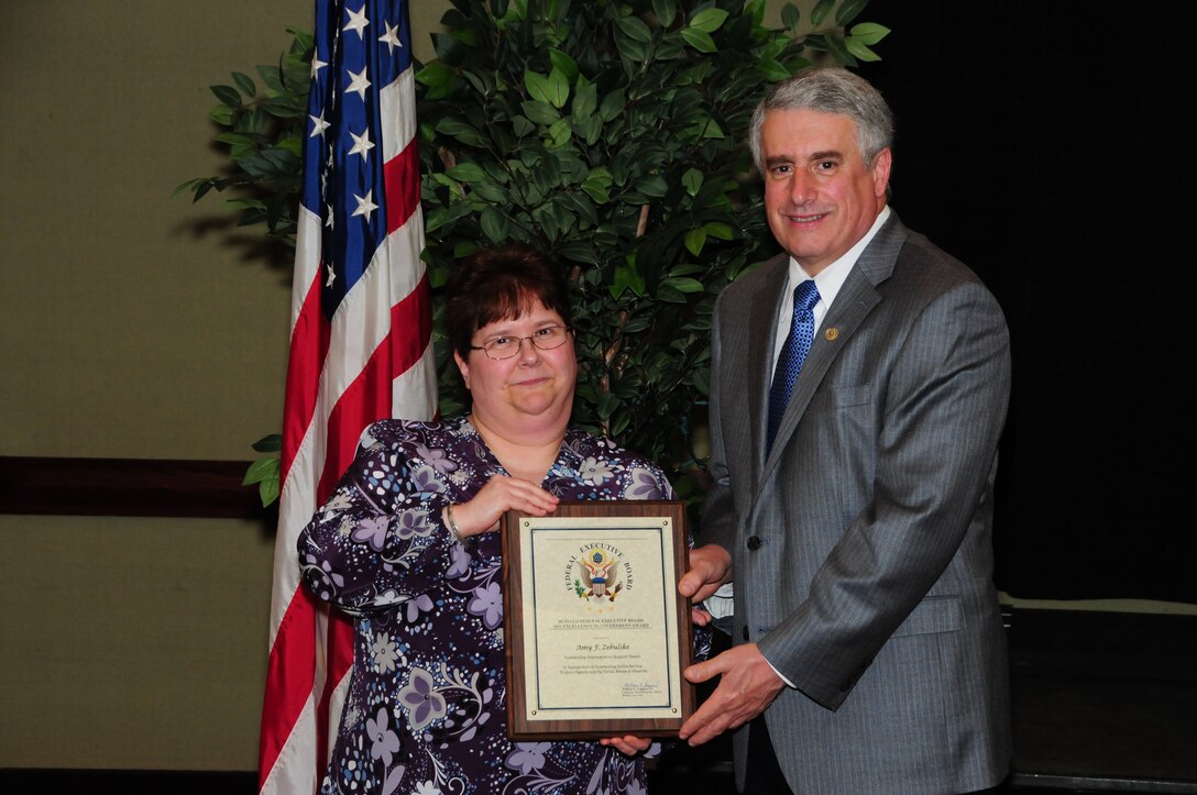 BUFFALO, N.Y.- Ms. Amy Zebulske, 914th Airlift Wing management assistant, was presented with the Outstanding Administrative Support Award for her management of 11 key administrative programs for the Logistics Readiness Squadron from Mr. William E. Leggiero, Jr., Buffalo Federal Executive Board Chairman. The Excellence in Government Awards Ceremony was held at the Buffalo Convention Center.  The 914th Airlift Wing was among many  other federal agencies represented at the ceremony. The wing had seven members win in six different categories. (U.S. Air Force Reserve photo by Peter Borys)