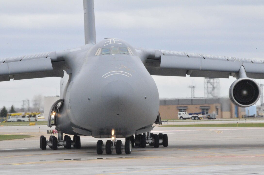An Air Force Reserve C-5 Galaxy arrives at the 934th Airlift Wing April 28 to pick up two fire trucks on the way to Global Medic at March AFB, Calif. (Air Force Photo/Paul Zadach)