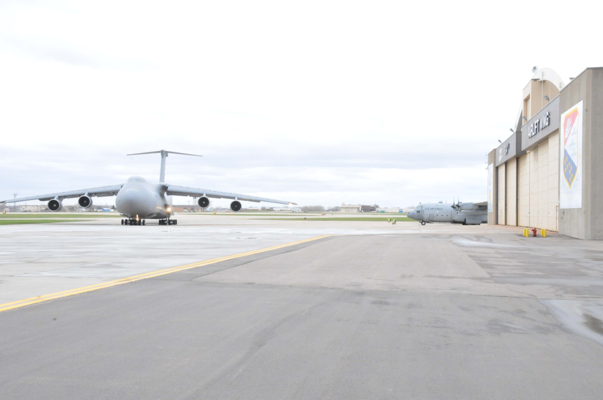 An Air Force Reserve C-5 Galaxy arrives at the 934th Airlift Wing April 28 to pick up two fire trucks on the way to Global Medic at March AFB, Calif. (Air Force Photo/Paul Zadach)