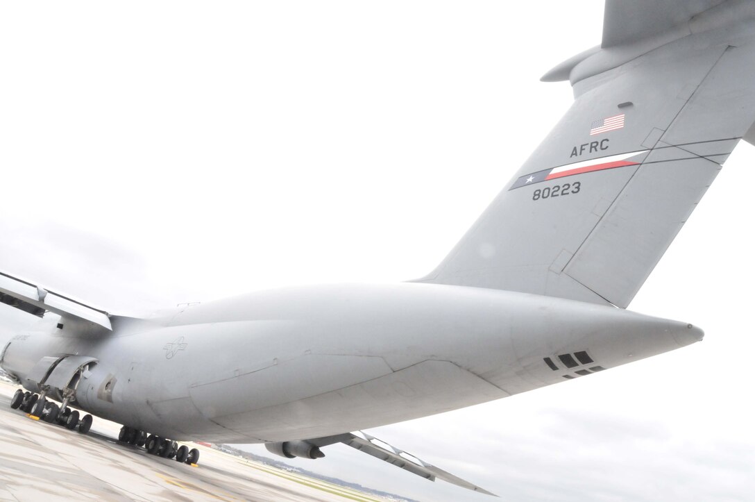An Air Force Reserve C-5 Galaxy arrives at the 934th Airlift Wing April 28 to pick up two fire trucks on the way to Global Medic at March AFB, Calif. (Air Force Photo/Paul Zadach)