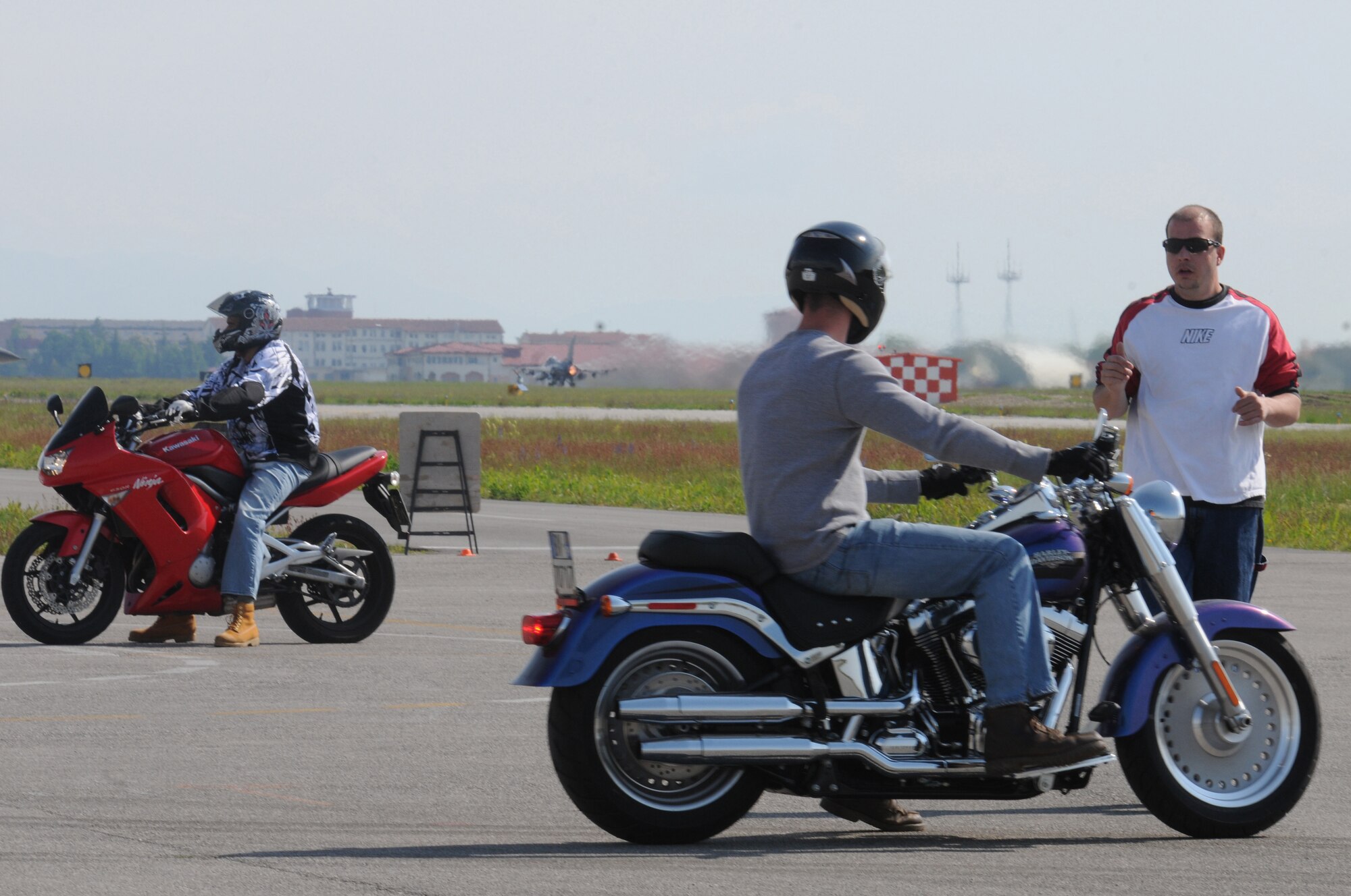 Tech. Sgt. Bradley Moore, Motorcycle Safety Foundation Basic Riders? Course instructor, critiques students attending the BRC at Aviano Air Base, Italy, April 28. Sergeant Moore provides 24 hours of instruction over a three day period before certifying that riders are qualified to operate a motorcycle in Italy and Europe.  (U.S. Air Force photo/ Staff Sgt. Nadine Y. Barclay)