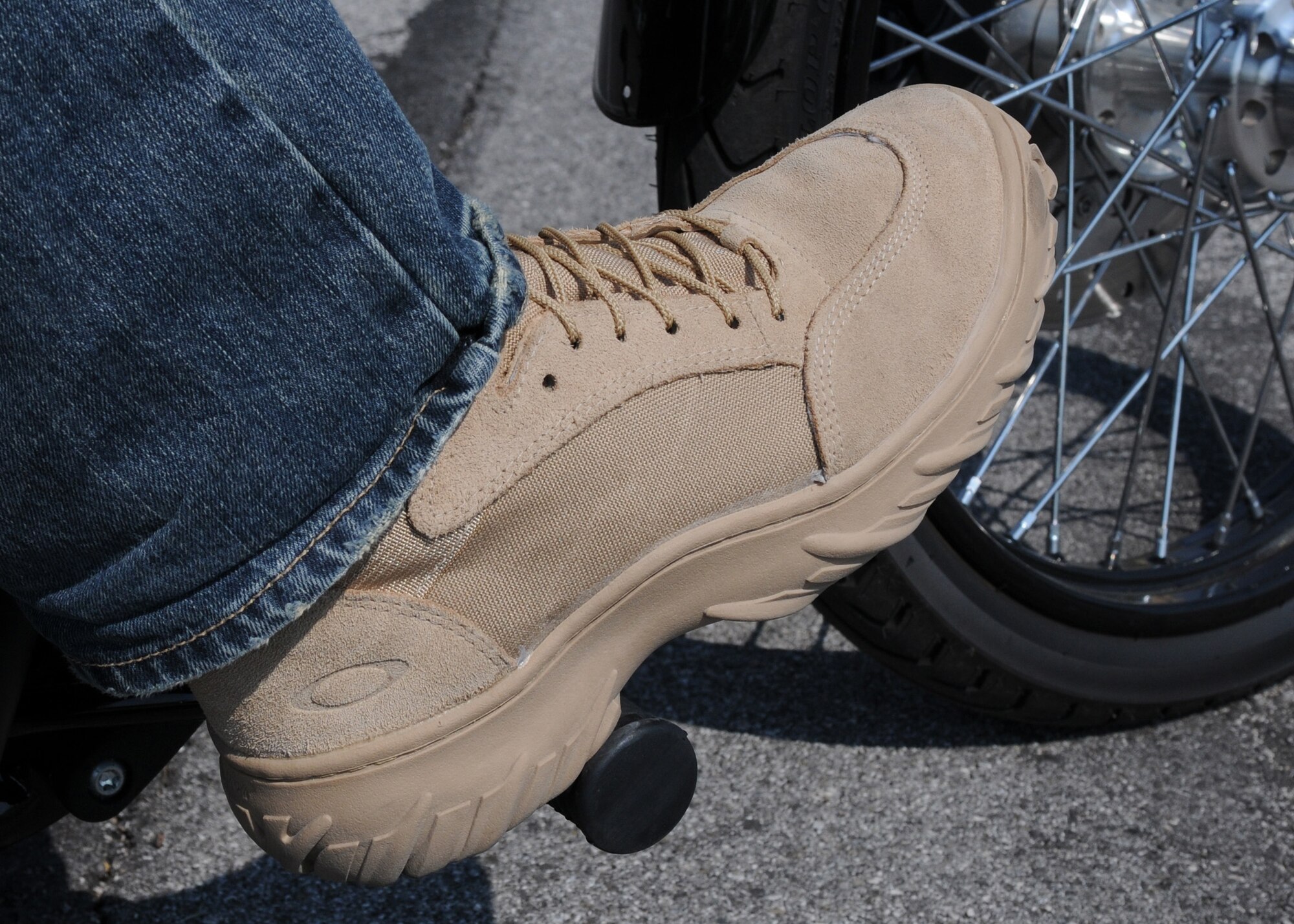 Tech. Sgt. Jason Smith, 31st Fighter Wing motorcycle safety program manager, demonstrates the proper protective gear required by Air Force Instruction 91-207 when operating a motorcycle. Protective eye wear, approved motorcycle safety foundation helmet, gloves, closed-toe shoes and brightly colored reflective clothing are all required items when operating a motorcycle on or off base. (U.S. Air Force photo/ Staff Sgt. Nadine Y. Barclay)