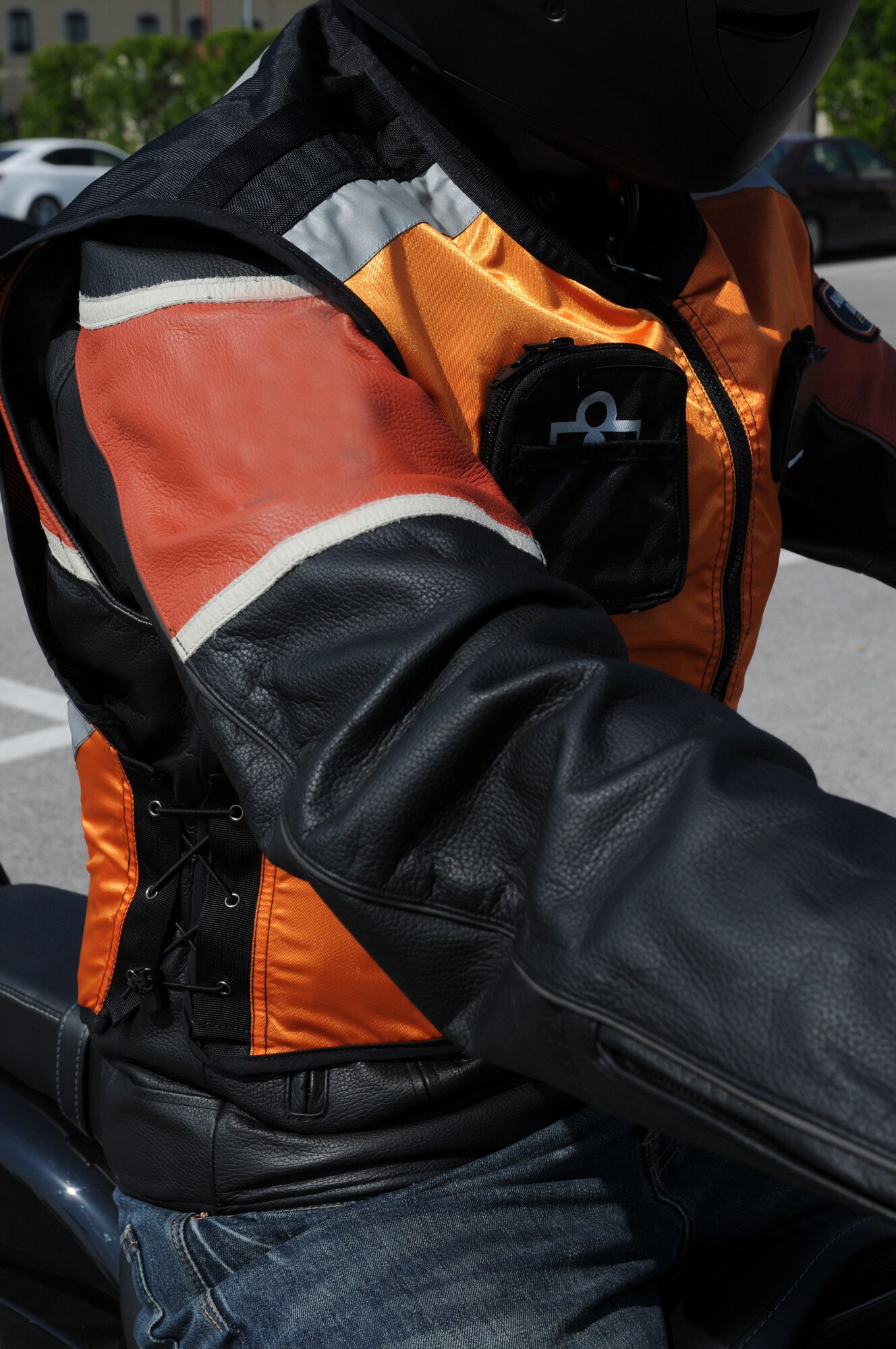Tech. Sgt. Jason Smith, 31st Fighter Wing motorcycle safety program manager, demonstrates the proper protective gear required by Air Force Instruction 91-207 when operating a motorcycle. Protective eye wear, approved motorcycle safety foundation helmet, gloves, closed-toe shoes and brightly colored reflective clothing are all required items when operating a motorcycle on or off base.   (U.S. Air Force photo/ Staff Sgt. Nadine Y. Barclay)