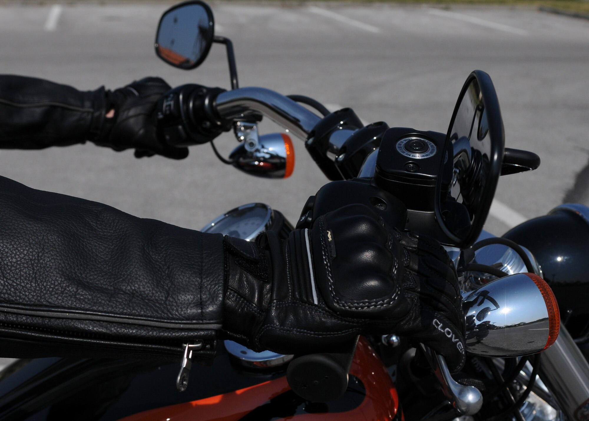Tech. Sgt. Jason Smith, 31st Fighter Wing motorcycle safety program manager, demonstrates the proper protective gear required by Air Force Instruction 91-207 when operating a motorcycle. Protective eye wear, approved motorcycle safety foundation helmet, gloves, closed-toe shoes and brightly colored reflective clothing are all required items when operating a motorcycle on or off base. (U.S. Air Force photo/ Staff Sgt. Nadine Y. Barclay)