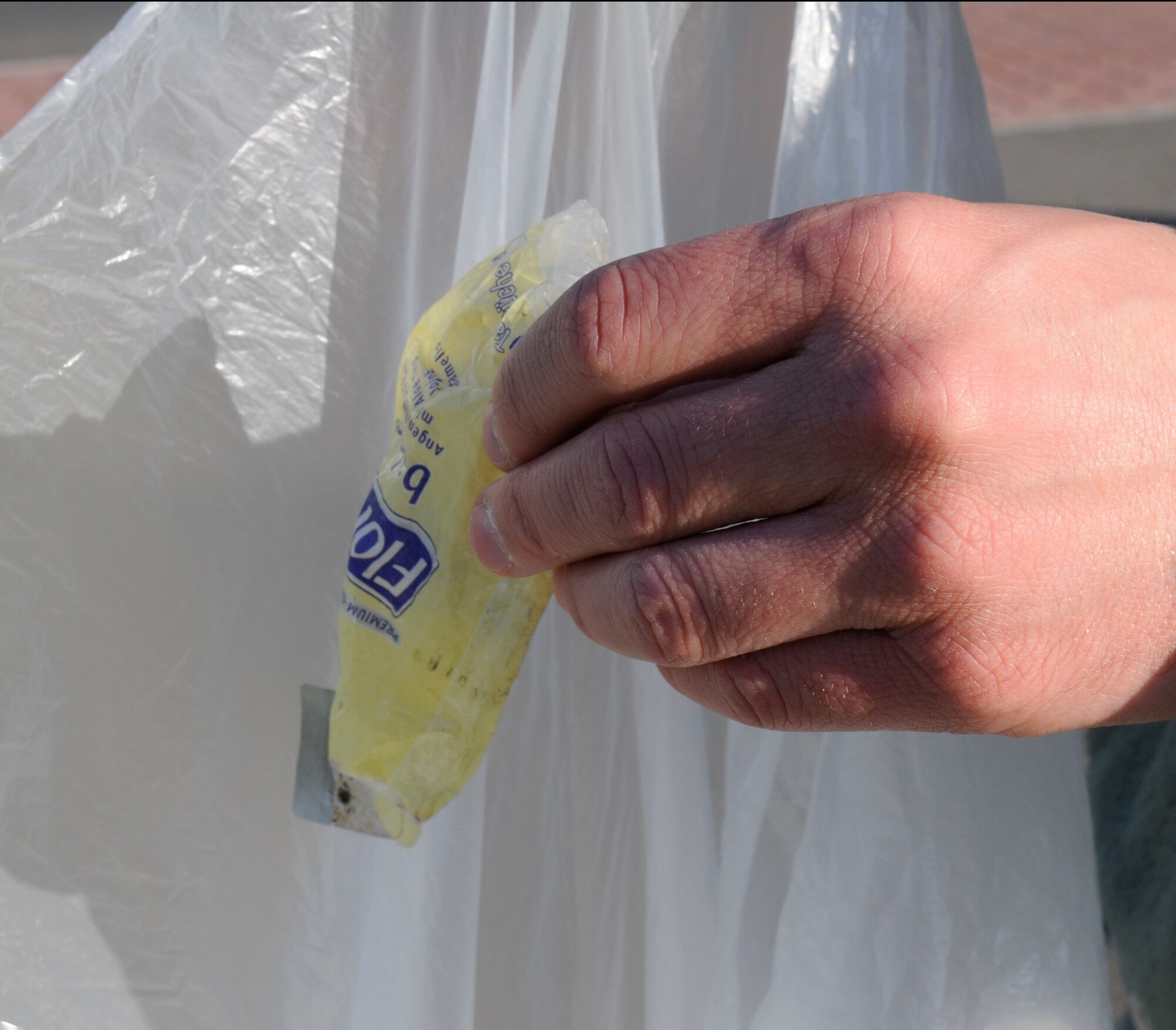 SPANGDAHLEM AIR BASE, Germany – Airmen from the 52nd Fighter Wing search for foreign object debris after the 2011 Spring Bazaar here May 2. The clean-up took place to prevent FOD from getting on the flightline and taxiways and potentially damaging aircraft. (U.S. Air Force photo/Airman 1st Class Brittney Frees)